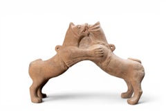 A Han Dynasty Pottery Pair of Wrestling Fu Dogs