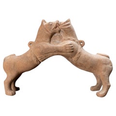 A Han Dynasty Pottery Pair of Wrestling Fu Dogs