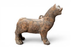 A Han Figure of a Standing Dog
