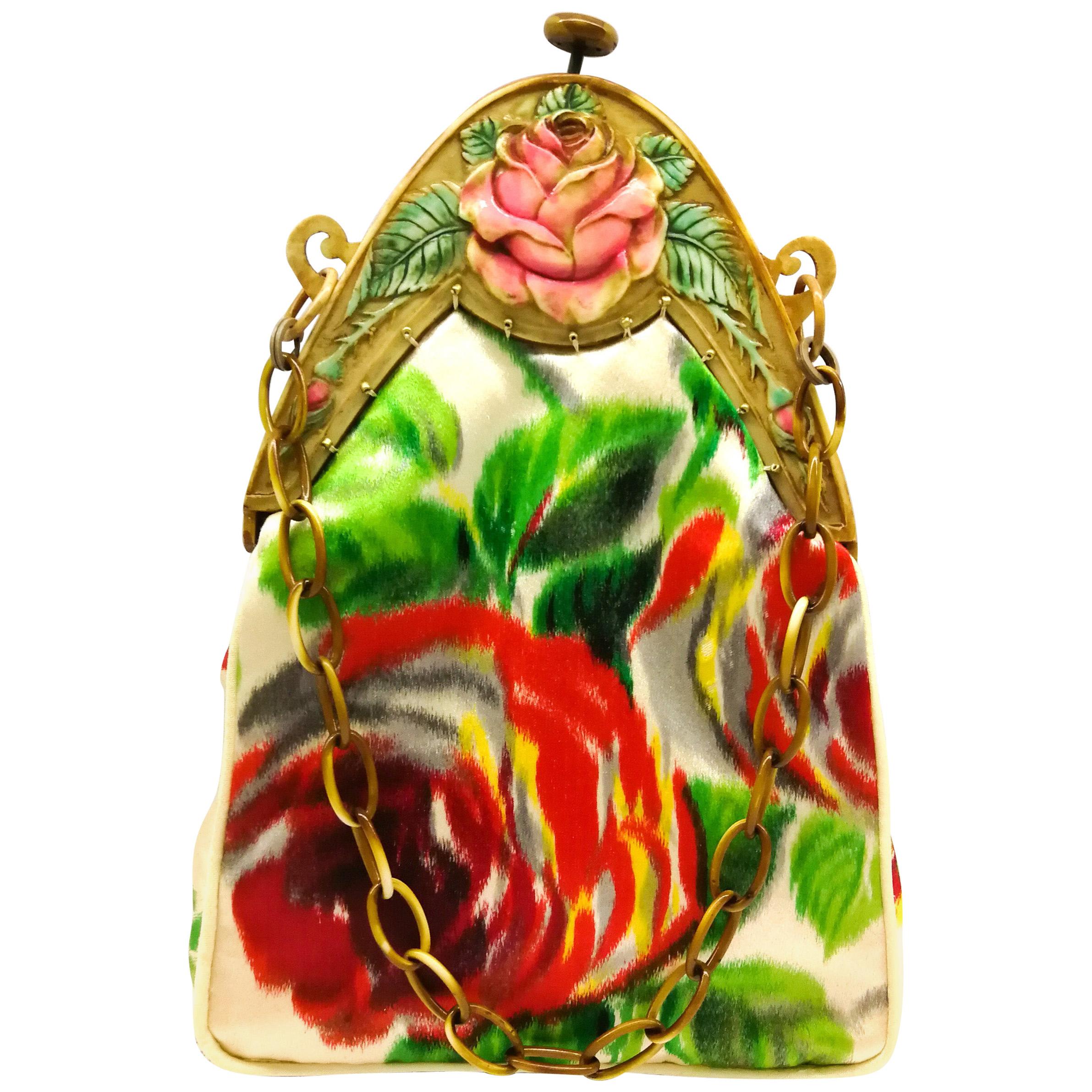 A hand coloured celluloid frame, and silk 'rose' motif handbag, French, 1920s