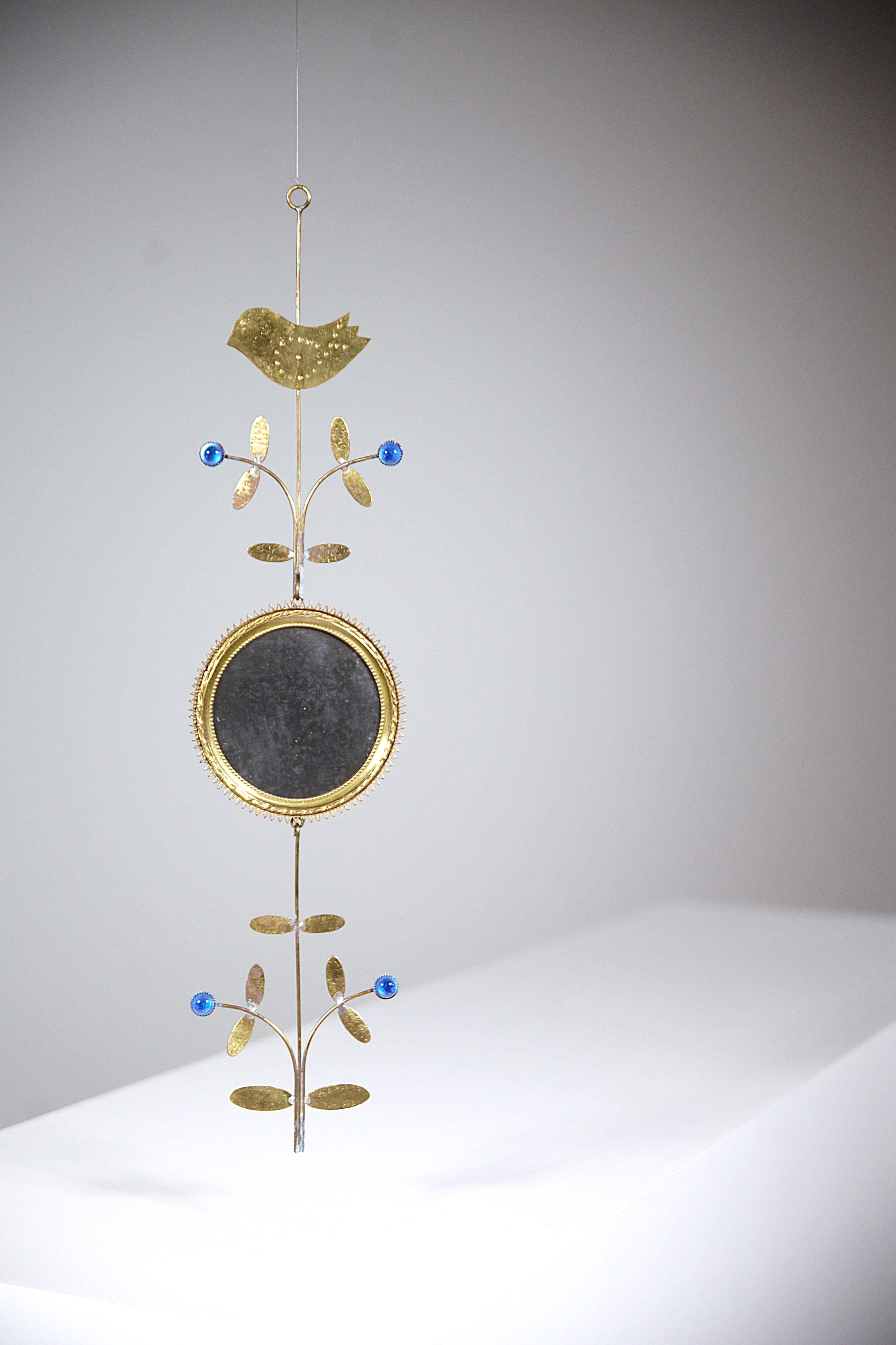 A Hand-Craft Mirror by Jean Vinay Bormes Les Mimosas France 1960's

Like a delicate and poetic sculpture. ( note the finesse of the artist's work ).

In three parts

In gilded iron & blue stones

In good condition.

Report : the mirror was hung in a