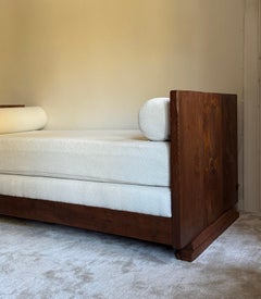 A hand-crafted wood and bouclé daybed, 21st century