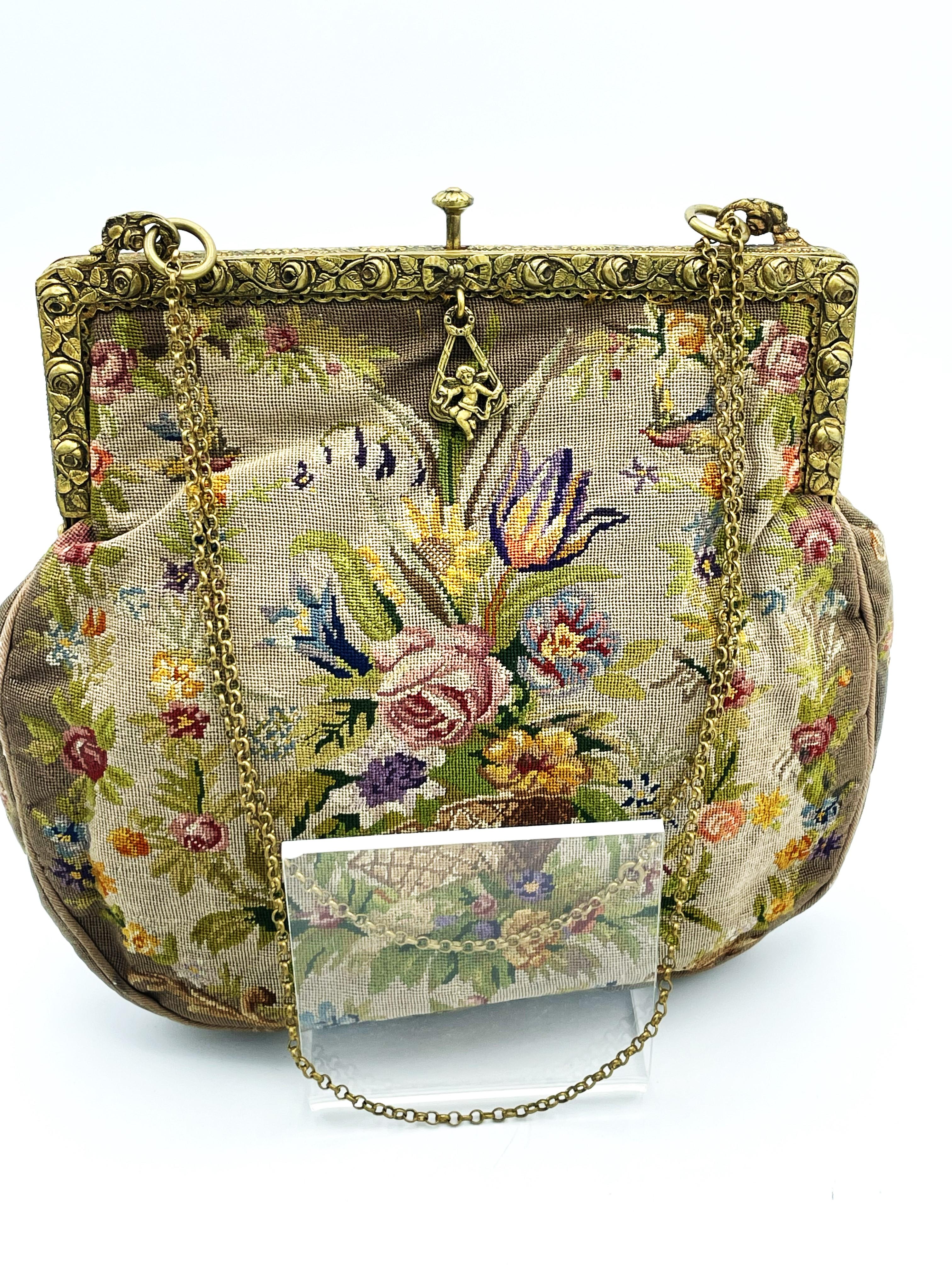 A hand embroidered evening bag with petit point embroidery all around. Front and back as well as the side stripes. Petit point is a fine magnifying glass work, The bag was embroidered in Germany at the turn of the century. Around 19th century. This