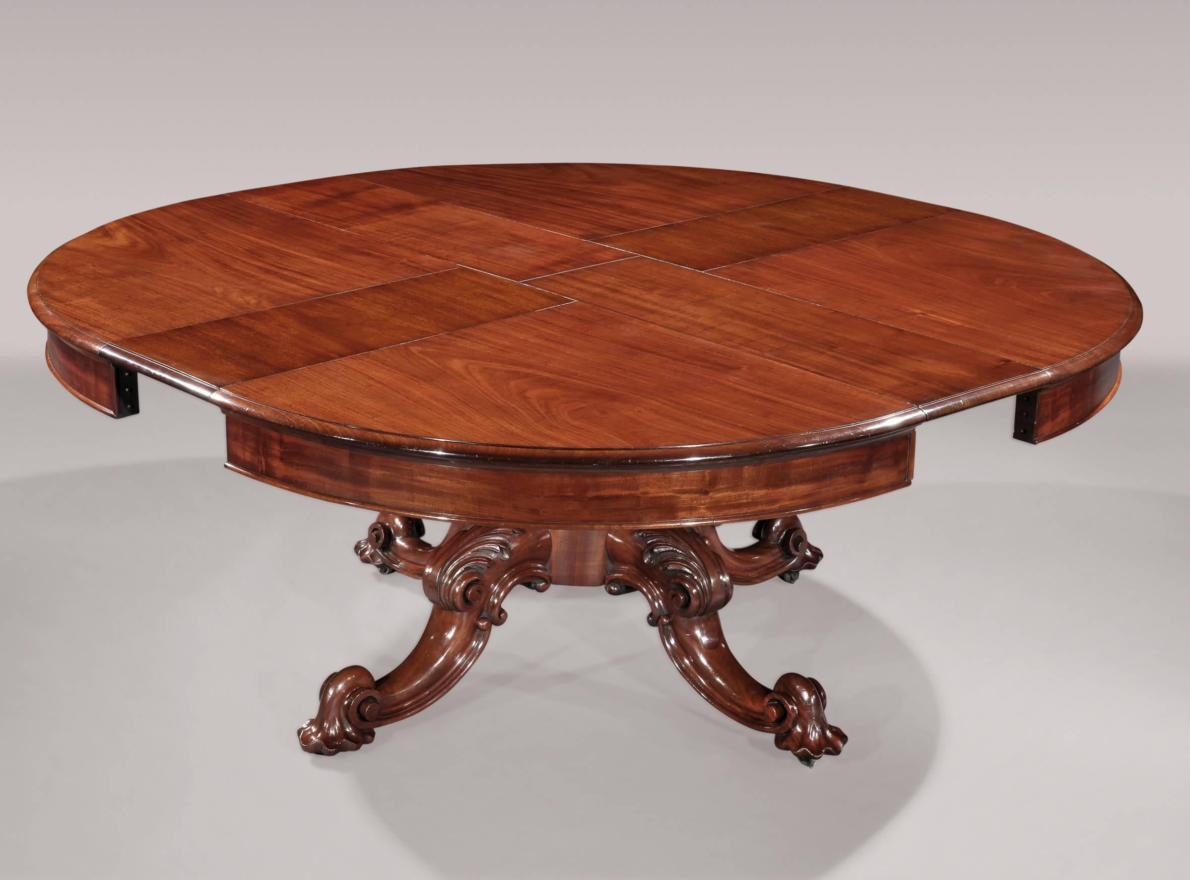 An impressive mid-19th century figured mahogany circular dining table with unusual wind-out extending mechanism bearing maker’s label: “T. H. Filmer’s cabinet, upholstery, bedding and carpet manufactory, 28.32.34 Berners St. Oxford St. London. W.”,