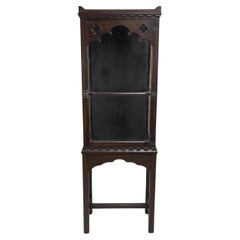 A handsome Gothic Revival oak display cabinet