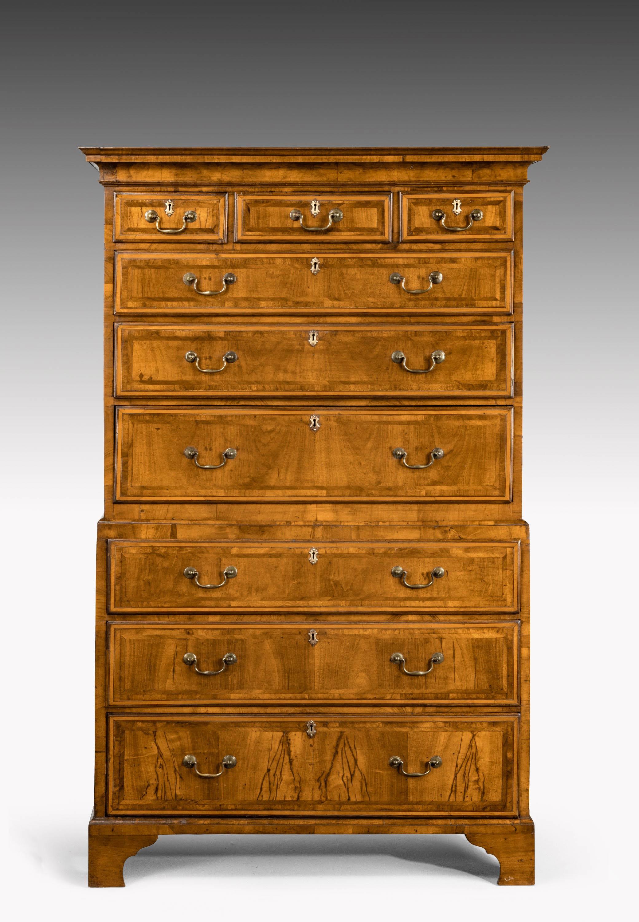 A very good looking mid-18th century walnut chest-on-chest of small proportions. With replaced period handles. The drawer fronts with complex inlaid walnut and herringbone etchings.
   