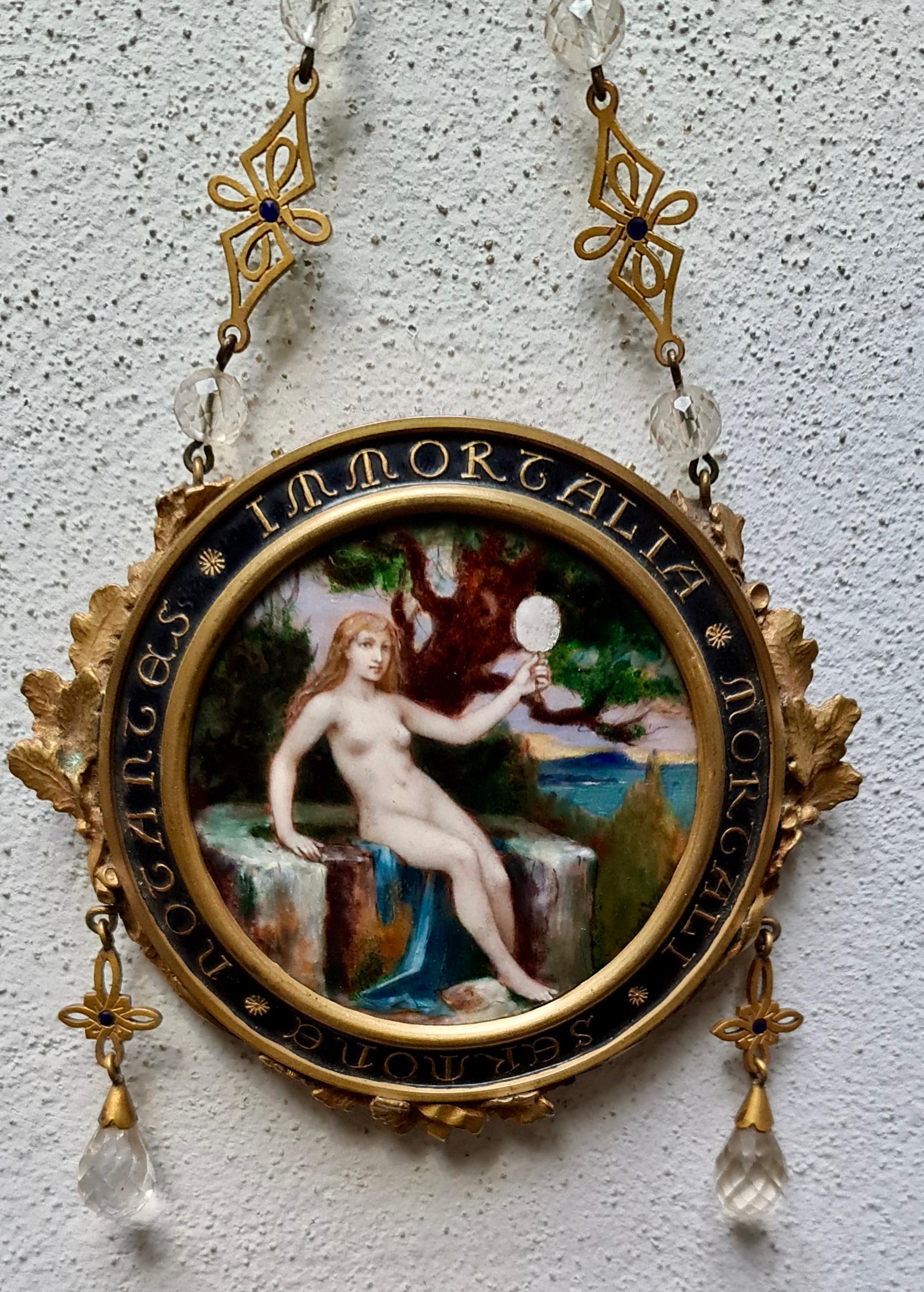 A hanging mirror and very fine painted enamel symbolist plaque by Paul Victor Grandhomme, (1851-1944)
It depicts a naked young woman in a landscape holding a mirror, probably an allegory of sacred love and profane love, all in a chiseled bronze