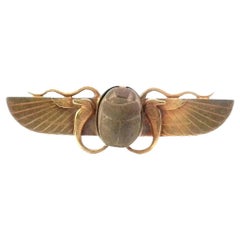 A hard stone  brooch in 18K gold