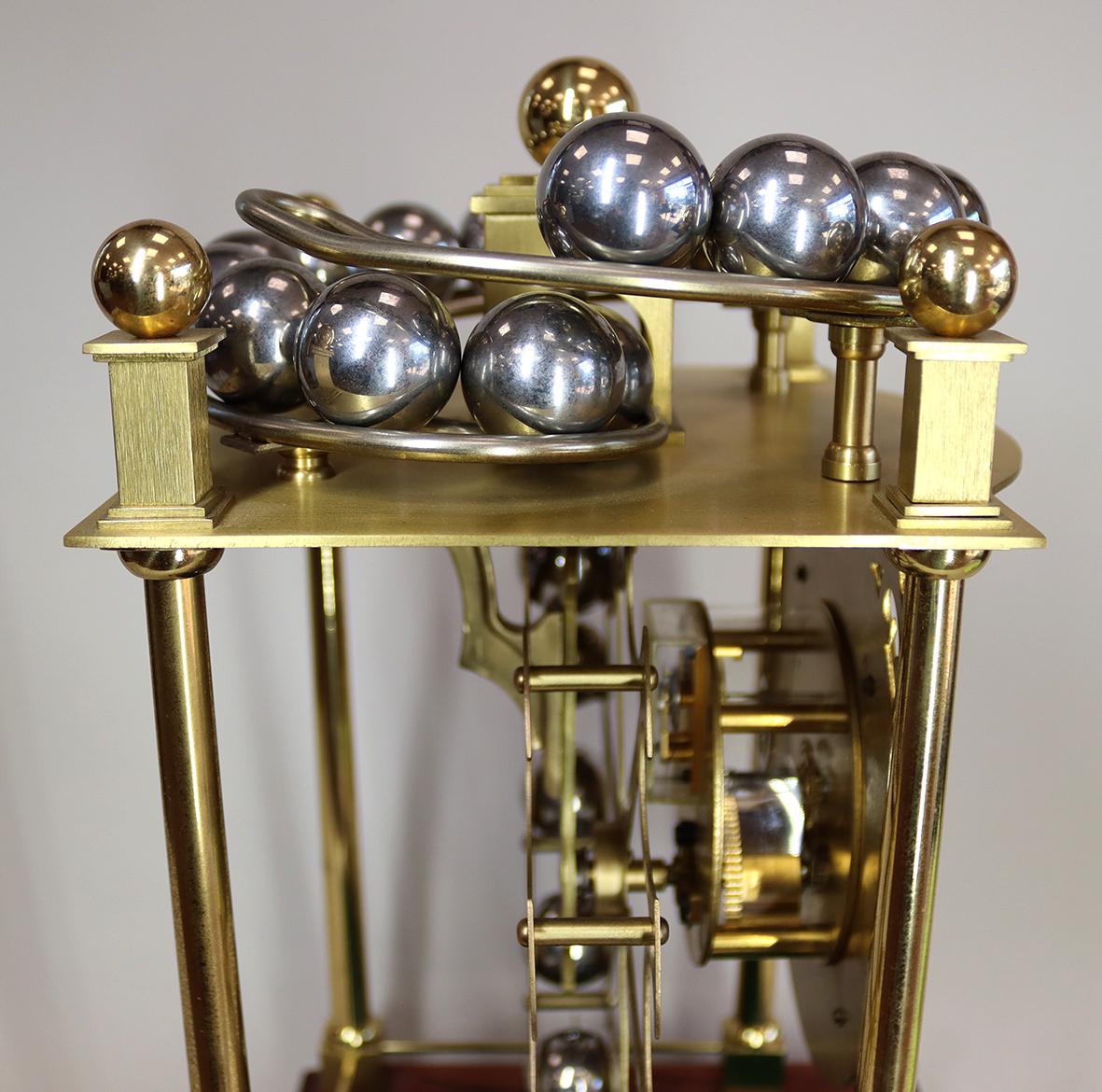 A Harding and Bazeley Limited Edition Spherical Weight Clock In Good Condition For Sale In Amersham, GB