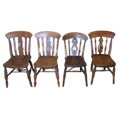 A Harlequin Set of 4 Beech & Elm Fiddle Back Chairs
