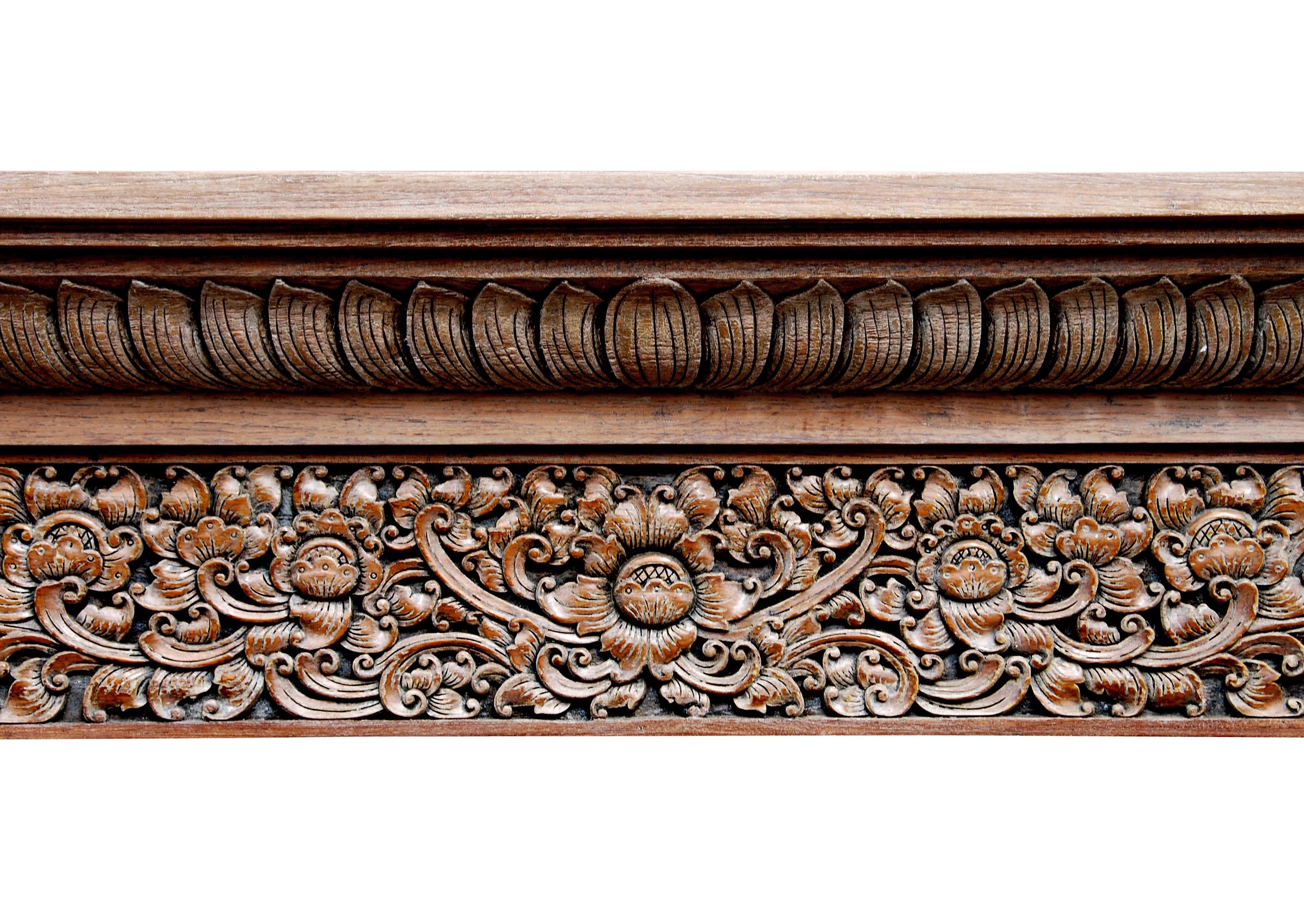 European Heavily Carved Hardwood Fireplace with an Oriental Influence For Sale