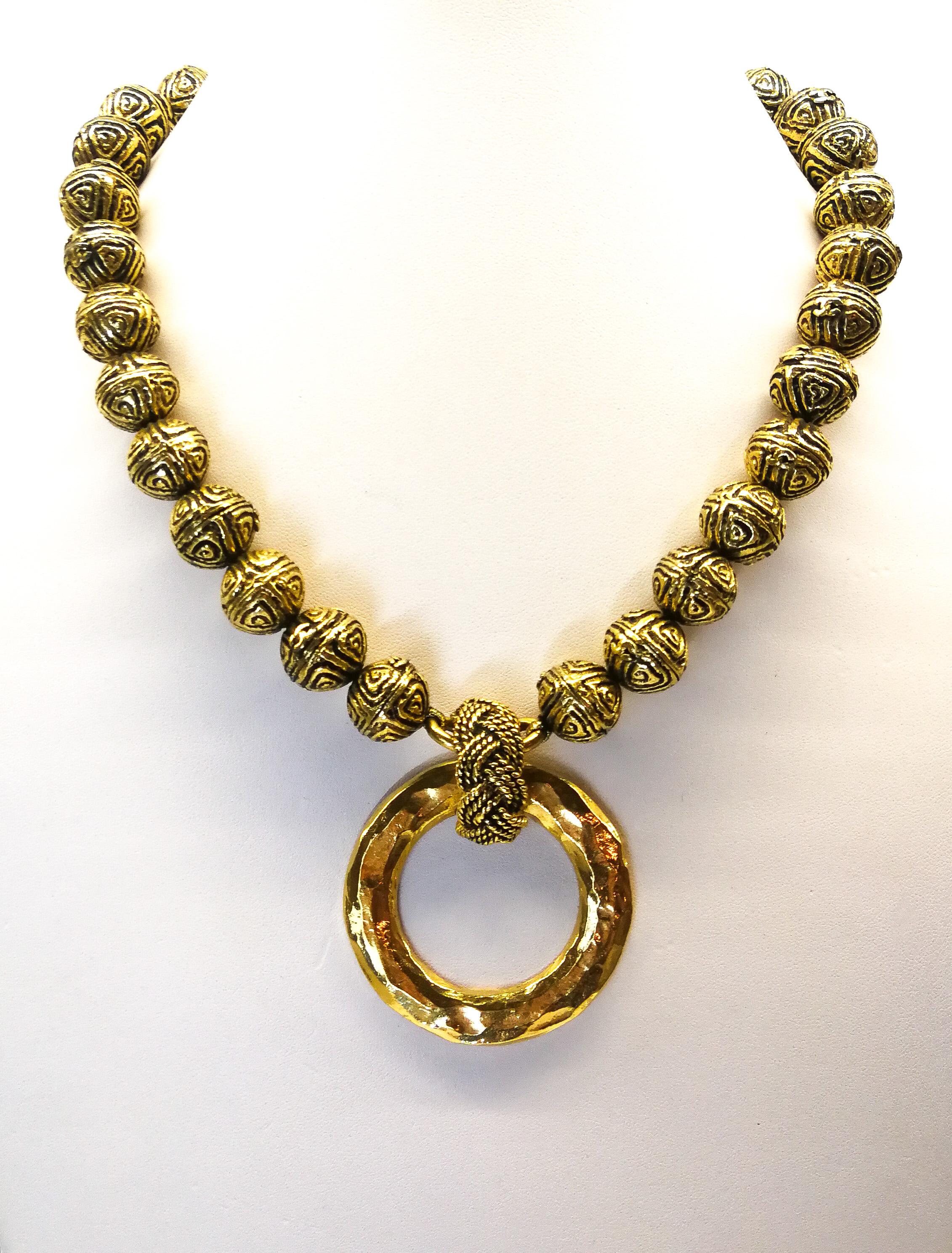 Women's A heavily engraved gilt ball and circle logo necklace, Chanel, France, 1980s