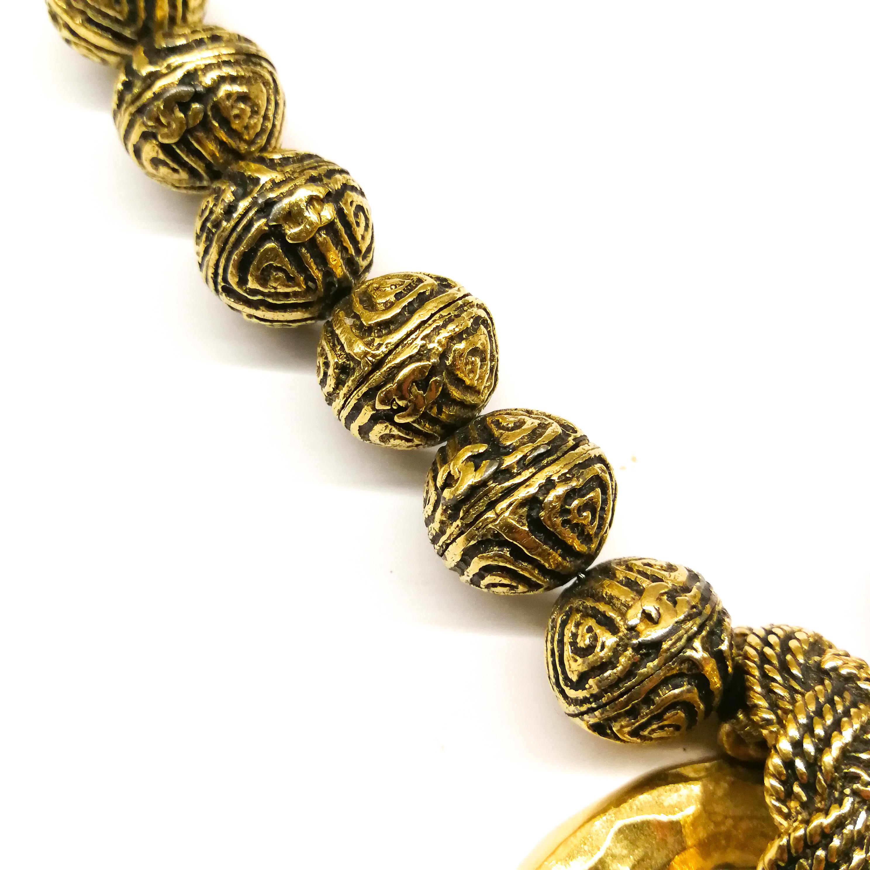 A heavily engraved gilt ball and circle logo necklace, Chanel, France, 1980s 1