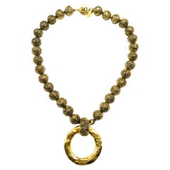 A heavily engraved gilt ball and circle logo necklace, Chanel, France, 1980s