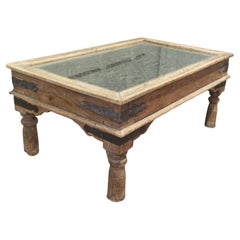 A Heavy Coffee Table with Inset Iron Grill Panel