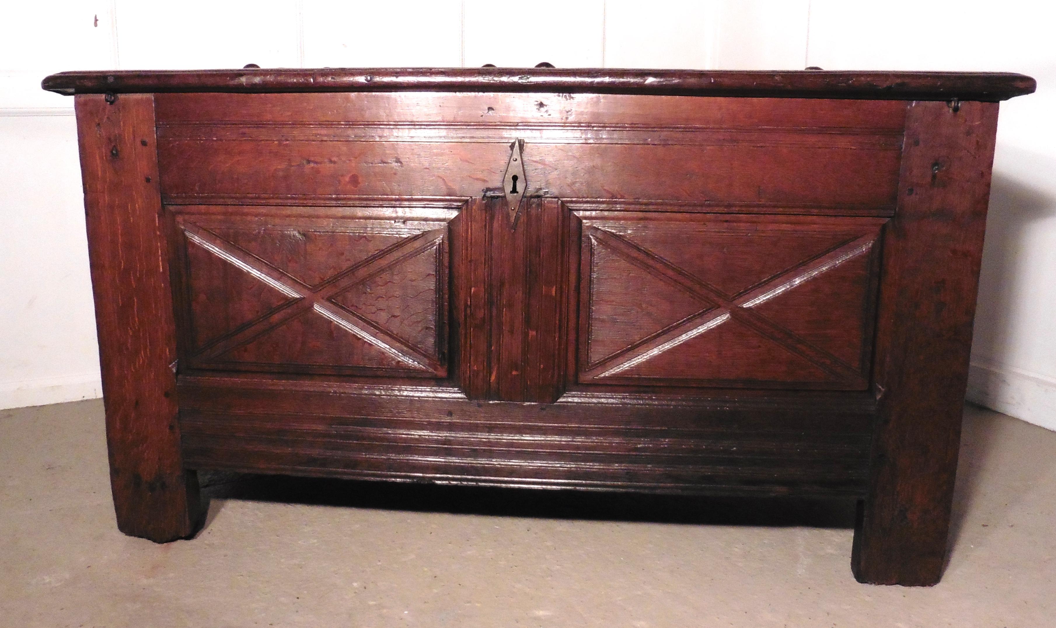 A Heavy French Panelled Oak Coffer

 The chest has 2 moulded panels on the front and 1 more on each side with a carrying handle
This is a very heavy piece it is made from solid Oak
The top of the box has a planked and moulded edge and it has a large