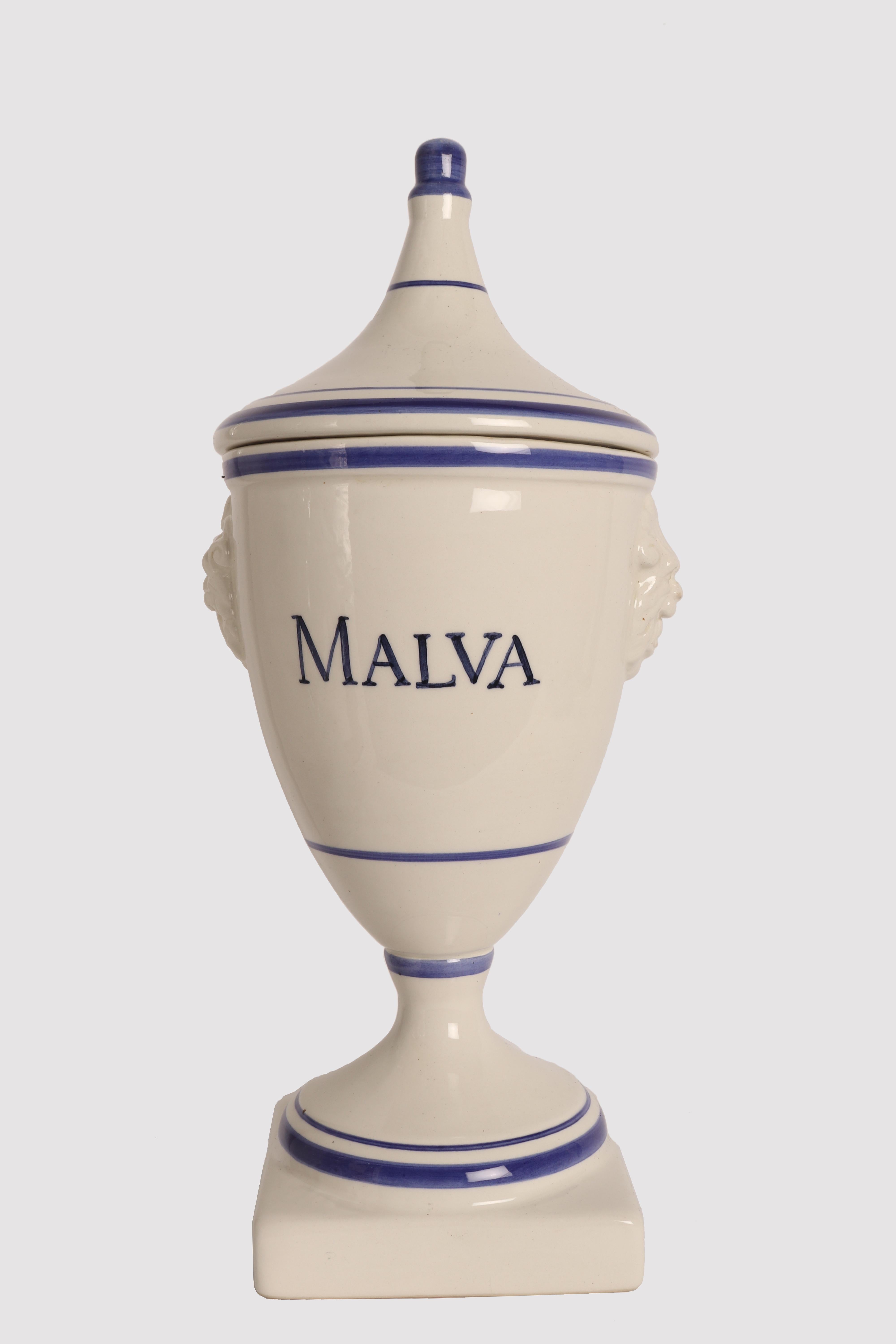 Set of five large apothecary-herbalist jars in white ceramic with cobalt blue decorations, to contain Mallow, Lobelia, Vervain, Rue, Burdock of neoclassical taste. The handle of the lid is in the shape of a stylized acorn, on the sides of the vase