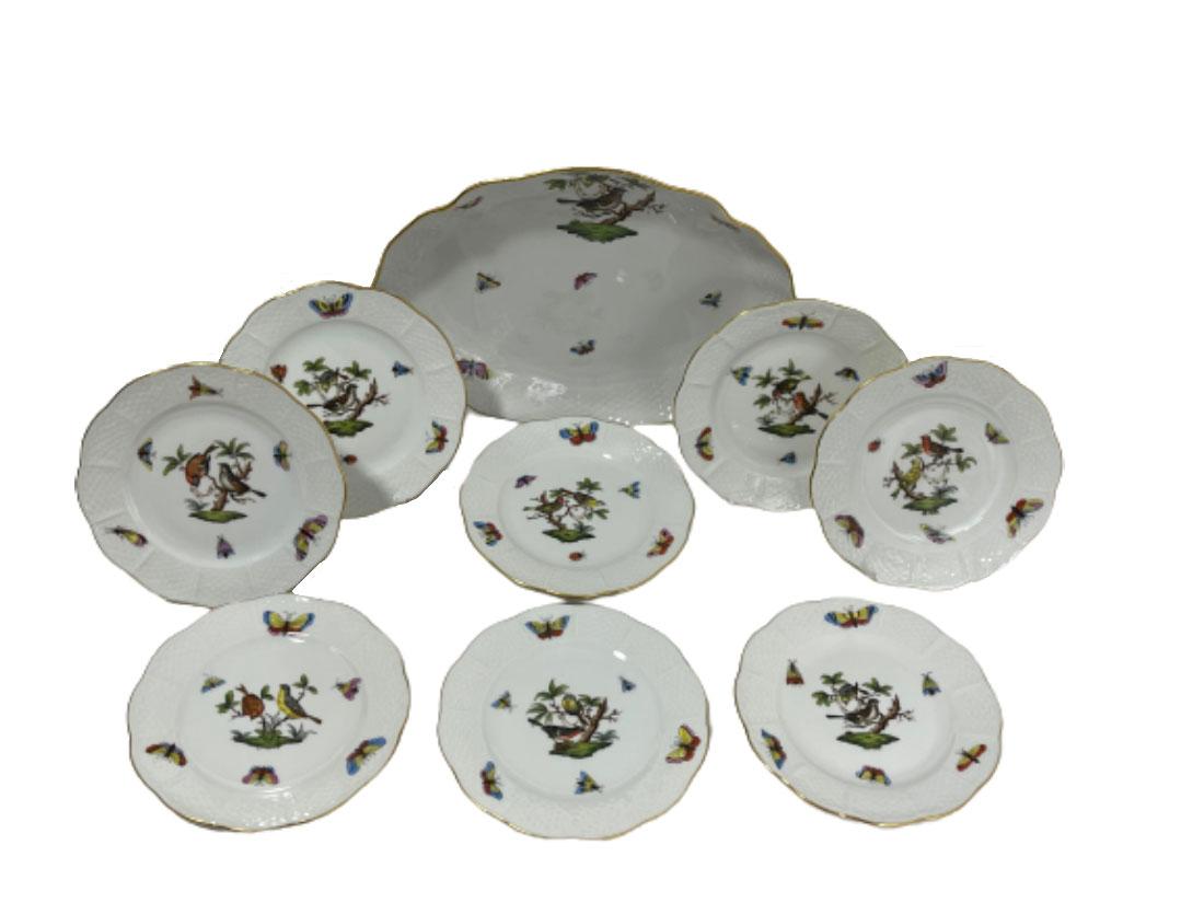 A Herend porcelain Rothschild pattern serving set

A Herend porcelain Rothschild pattern serving set, consisting of 8 plates of 15 cm diagonal (5.9 Inch) and a serving tray with scalloped raised edge and is 26.5 cm wide (10.4 Inch) and 21 cm deep