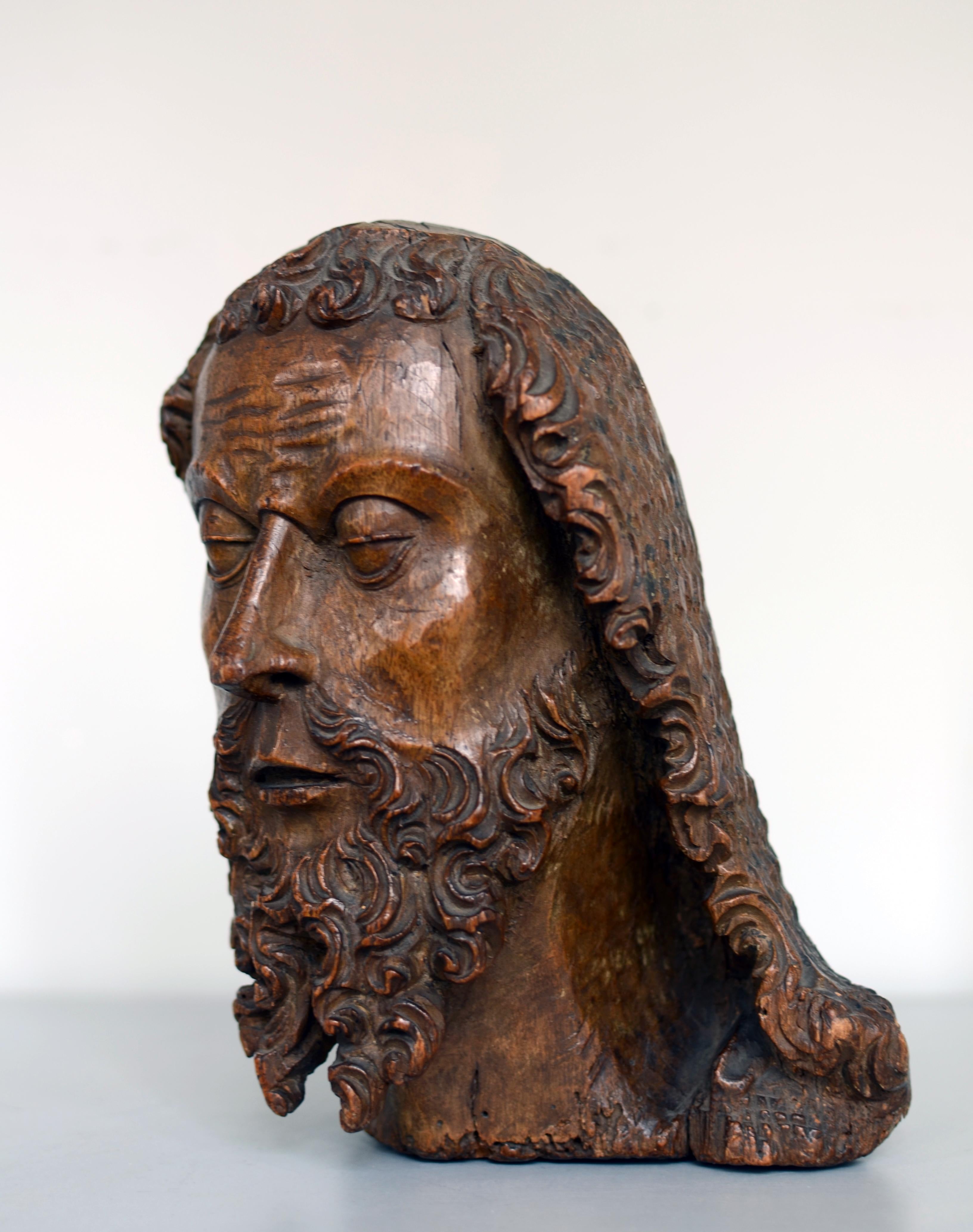 A High Gothic bust of a bearded saint
Sphere of Simon de Colonia or Lorenzo Mercadante de Bretaña; 15th century
Walnut; approximate size: 23 cm (h)

The present bust of a saint, probably John the Baptist, can be linked to the workmanship of a