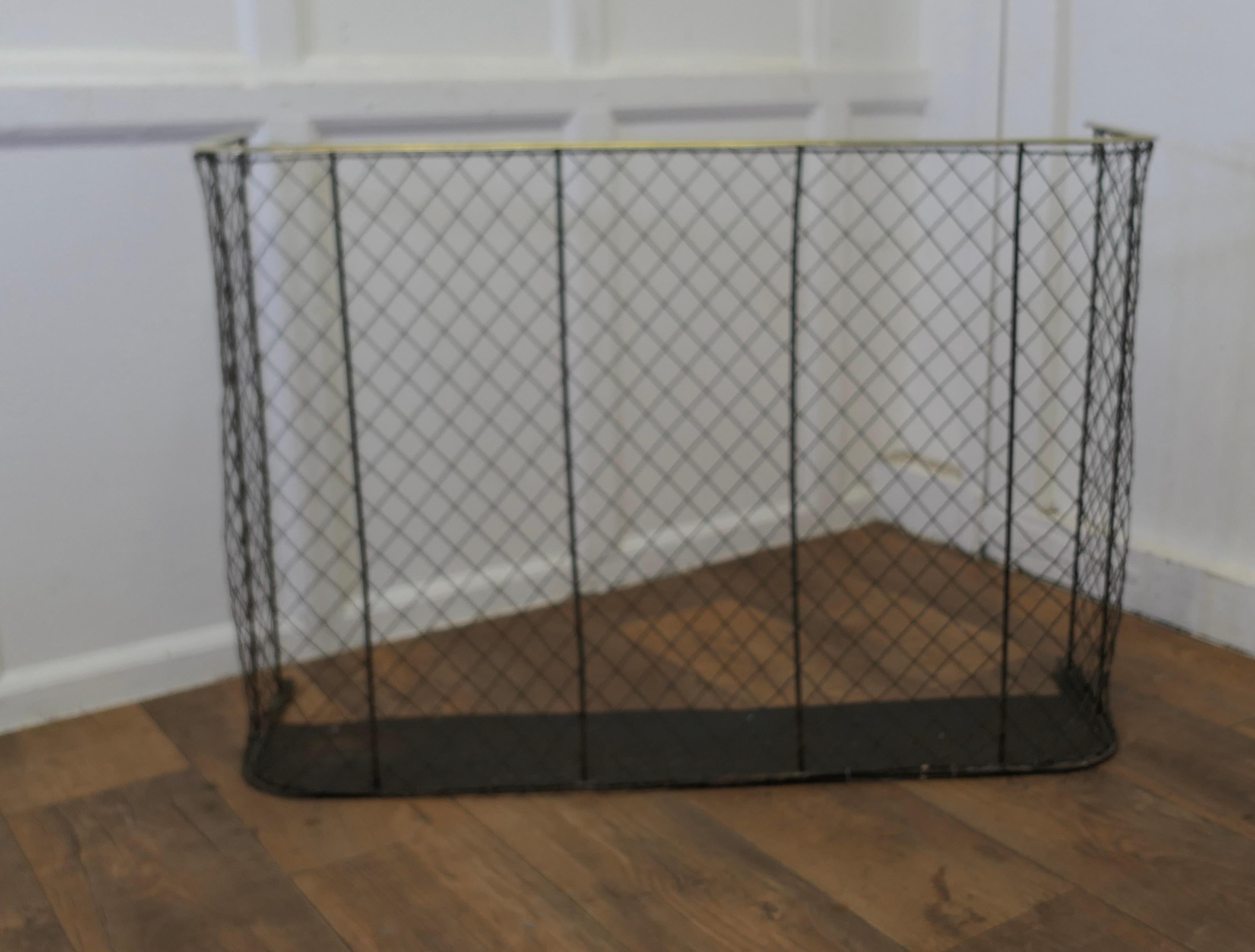 A High Victorian Nursery Fire Guard, Brass Fender 

A large, Early Victorian antique fire guard often known as a nursery guard as it completely surrounds the fire 
The fender has a slightly curved brass topped rail, with wire mesh, it is in good