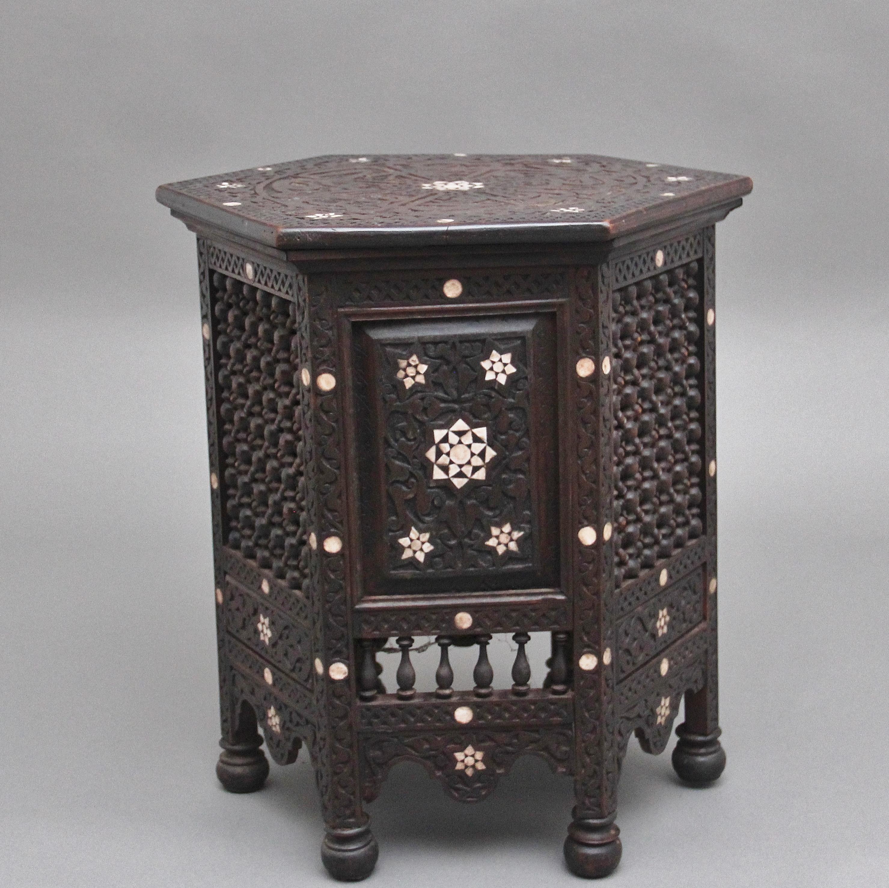 A highly decorative 19th Century Moorish occasional / side table, the hexagon shaped top with carved Moorish design with various star decoration, each side of the table is in keeping with the Moorish style of the top but incorporating various