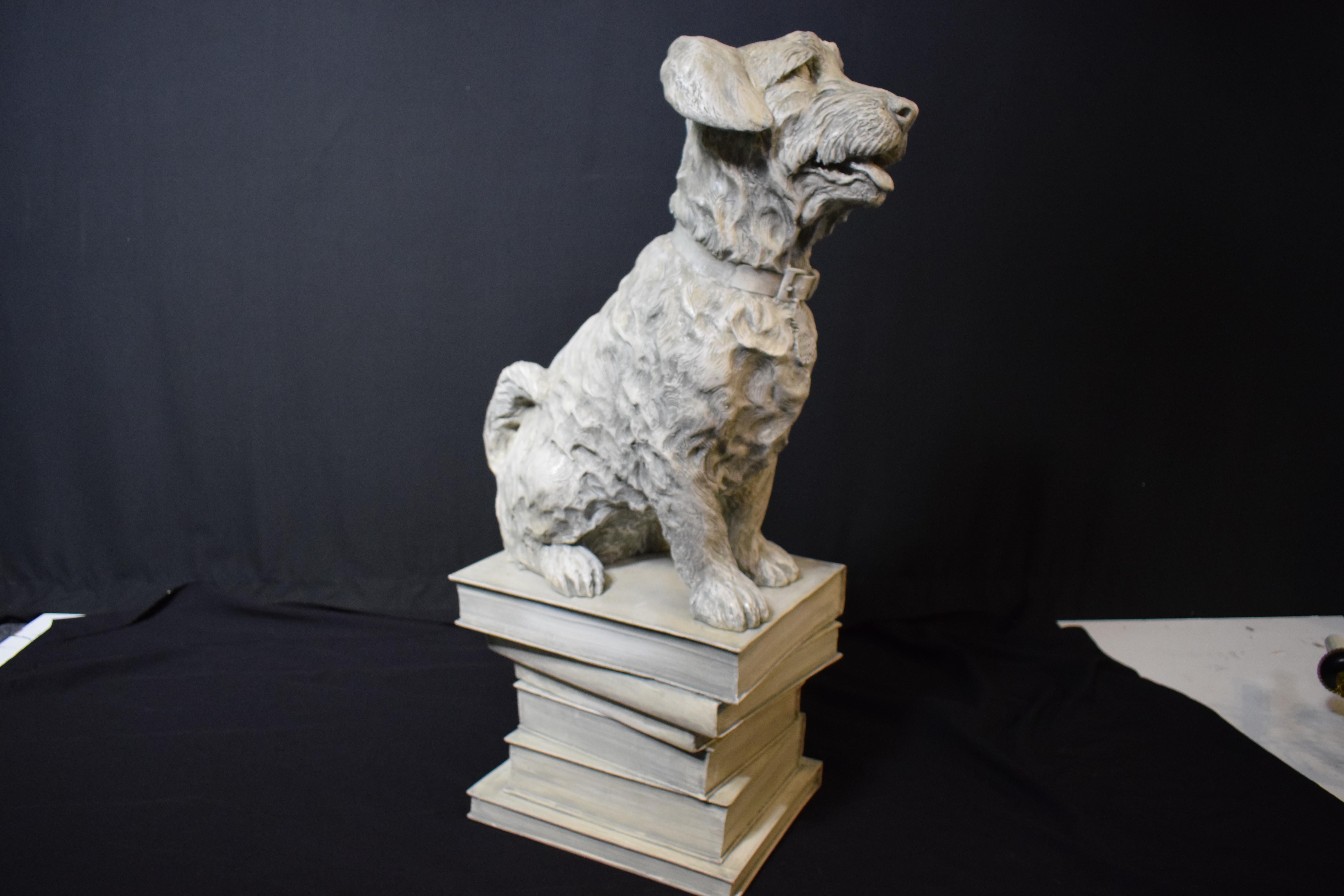 A highly decorative full size sculpture of a dog sitting on books. Great detail.
Dimensions: Height 35 1/2