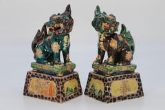 A highly decorative pair of Chinese pottery Buddhist lions circa 1900.