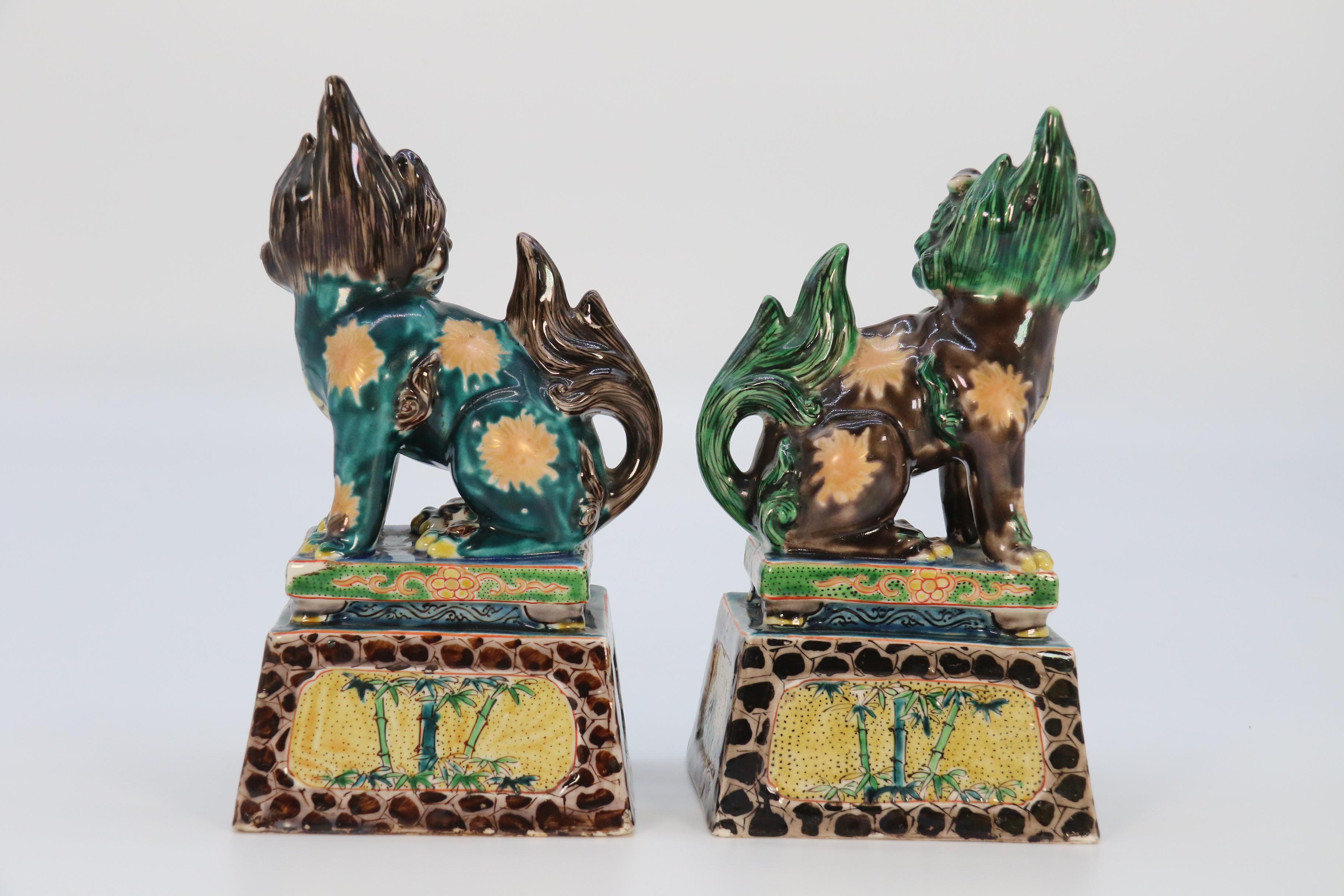 20th Century A highly decorative pair of Chinese pottery Buddhist lions circa 1900. For Sale
