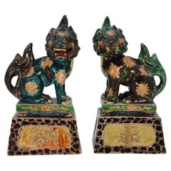 A highly decorative pair of Chinese pottery Buddhist lions circa 1900.