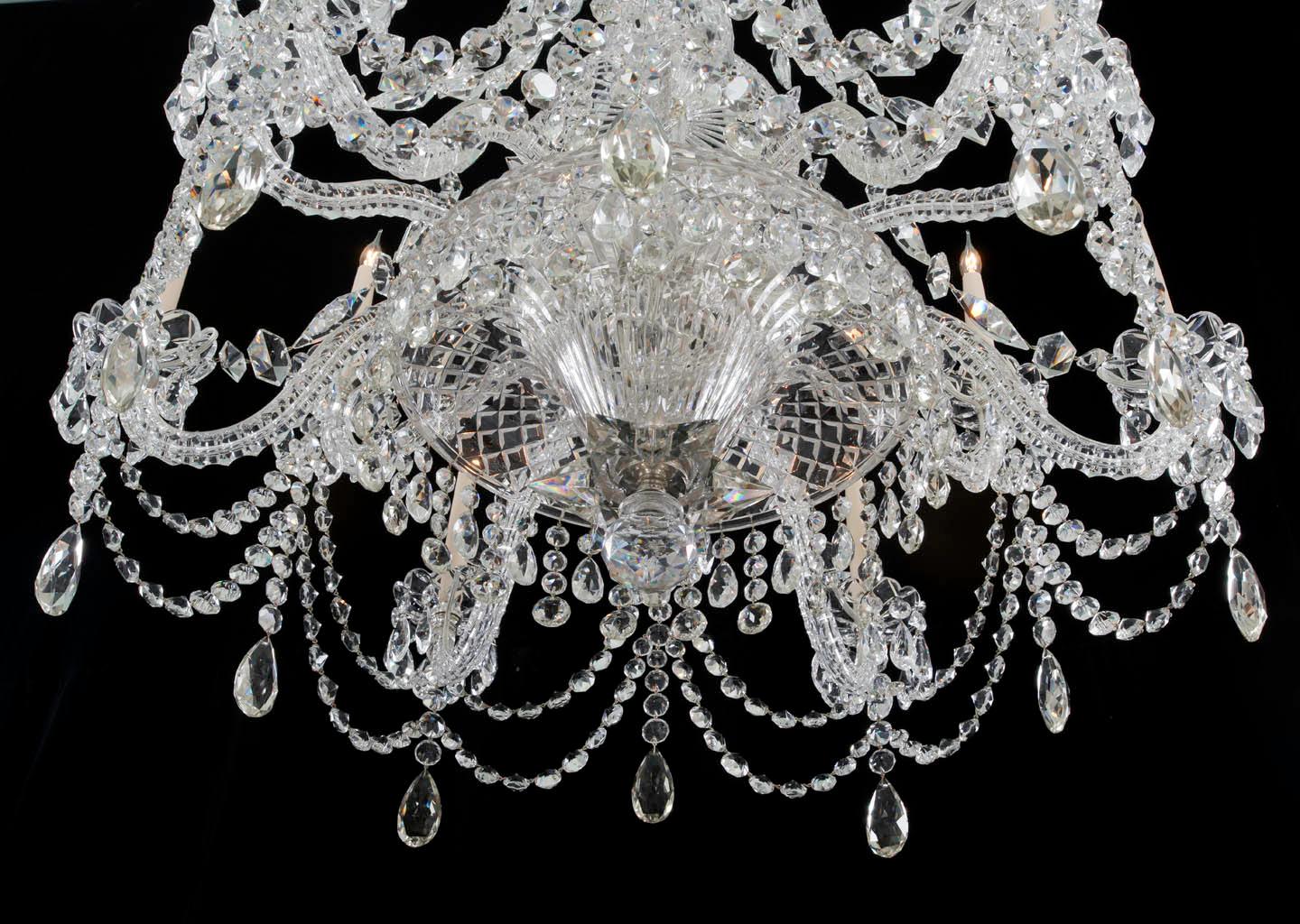 A fine quality Victorian twelve-light cut glass and silvered mounted chandelier the flat diamond cut baluster stem surmounting by six thumb cut Sheppard crooks terminating with trumpet shaped top piece, the flat diamond cut turnover drop hung