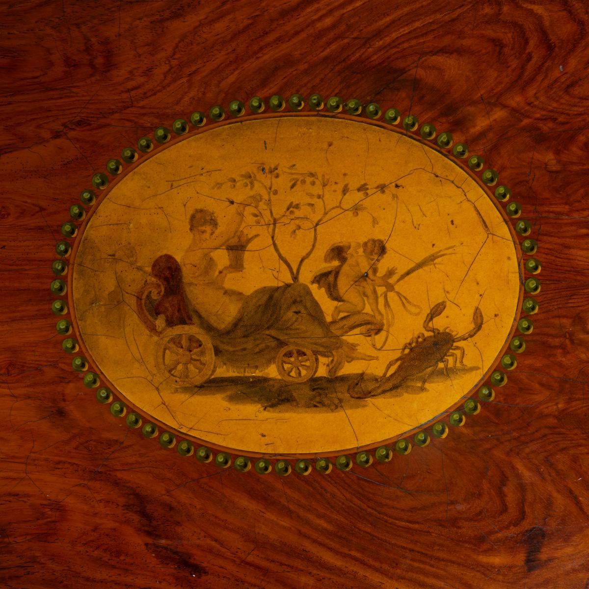 A highly interesting Kingwood regency work table with engraving of the Month of October/Scorpio after Burney c.1810

This fine table has the usual work bag hanging from the top, designed to hold partially completed sewing and needlework projects.