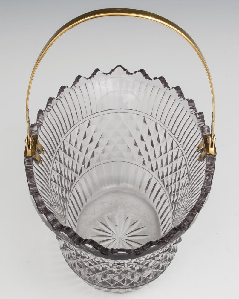 A fine diamond and flute cut glass basket with vandyke rim and star cut base mounted with a ormolu handle with the makers mark CB.
Height 23.5 cm (9 1/4
