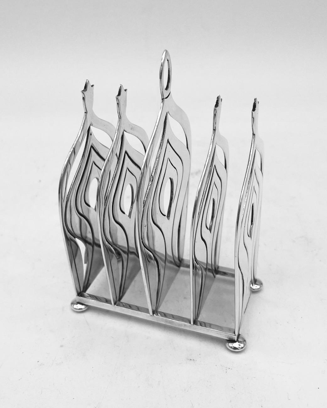 A beautifully designed sterling silver letter or toast rack, made by the renowned silversmith George Grant McDonald, and hallmarked for London 2007.
This lovely piece is particularly heavy weighing 323g, and will make a fine addition to any