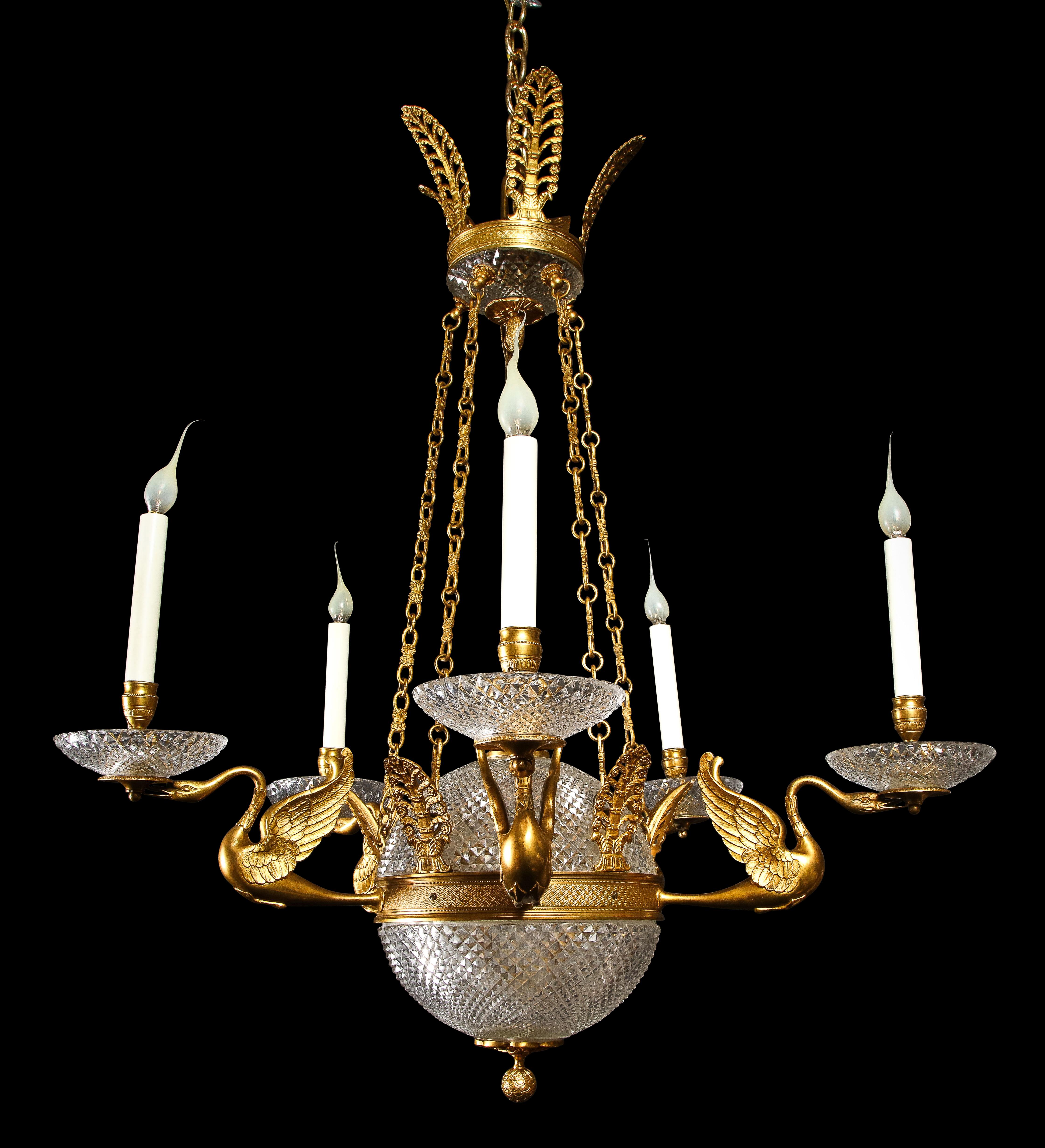 A Unique Large Antique French Hollywood Regency Gilt Bronze and Cut crystal ball form multi light swan chandelier. This fine chandelier is embellsihed with a large central cut crystal ball which is adorned with six gilt bronze arms of superb detail