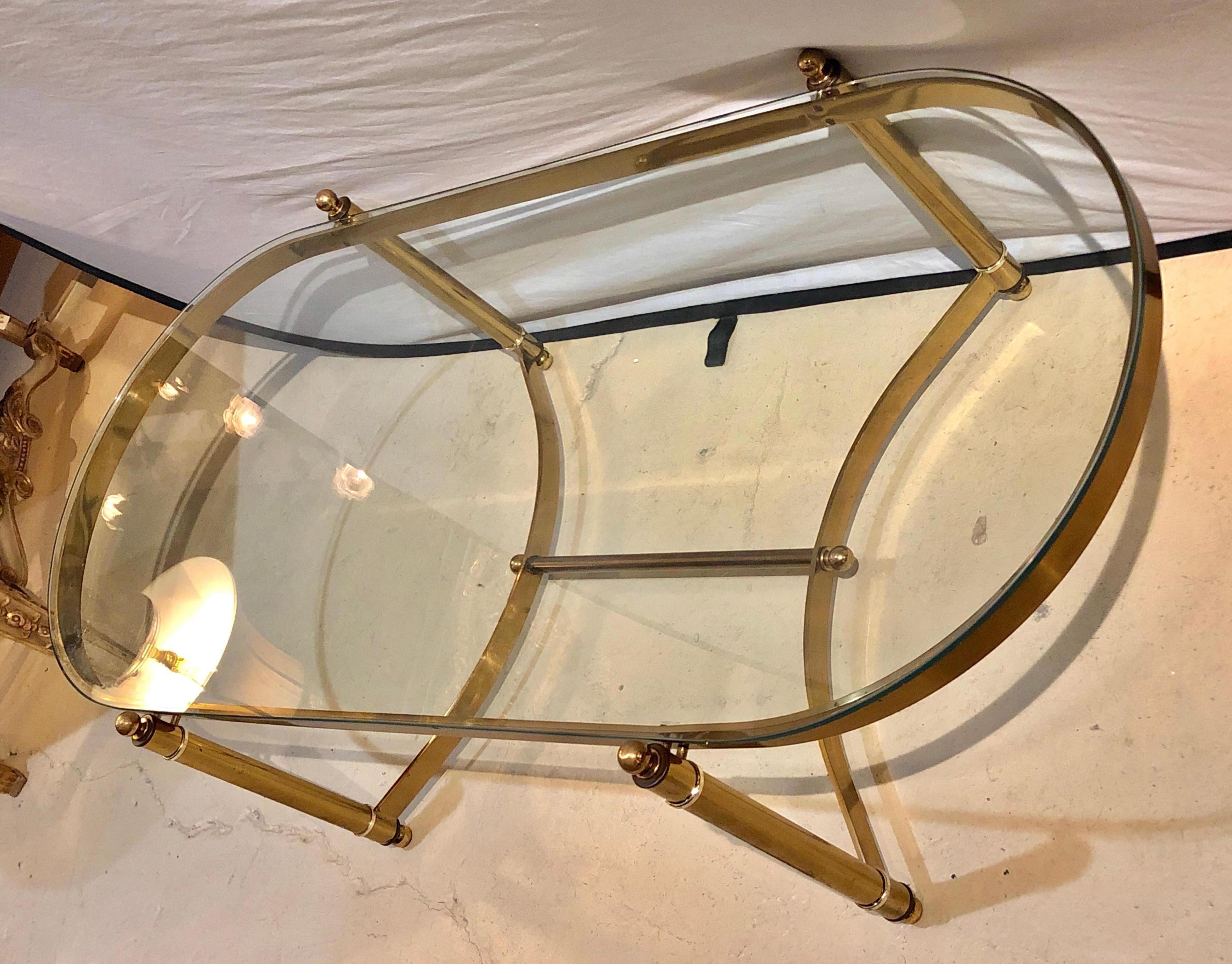 Hollywood Regency Style Heavy Brass Oval Coffee Table with a Glass Top In Good Condition In Stamford, CT