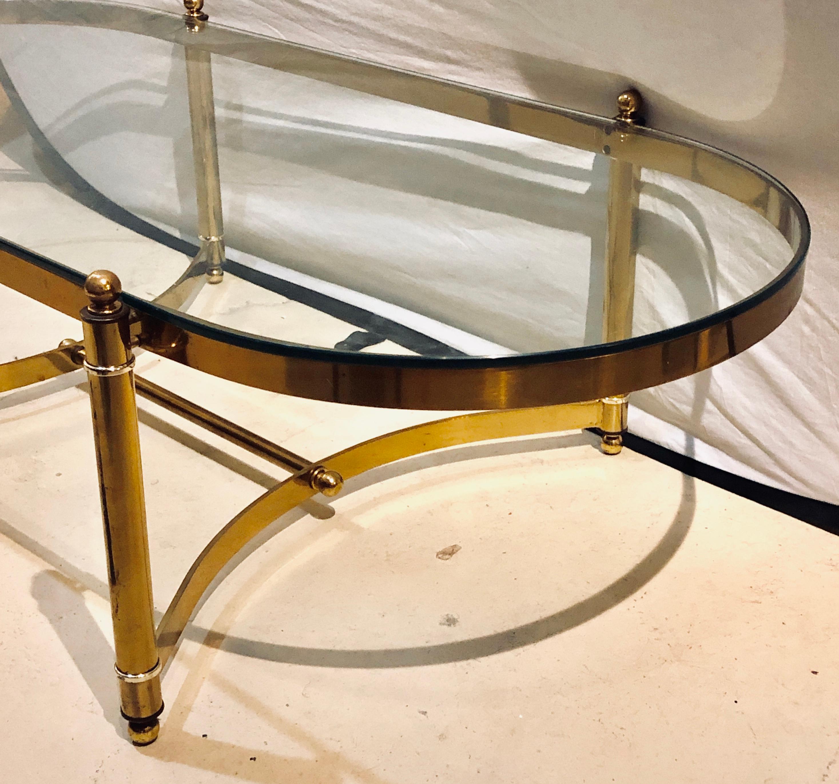20th Century Hollywood Regency Style Heavy Brass Oval Coffee Table with a Glass Top
