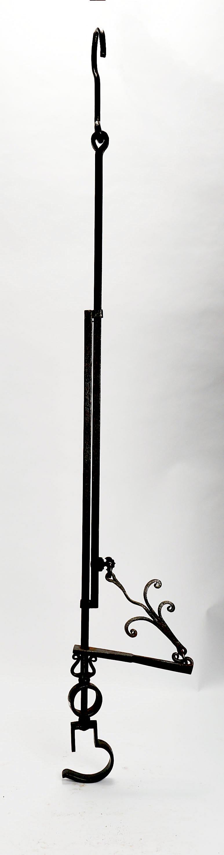 A pothook (or pot hook) S-shaped metal hook for suspending a pot over a fire, a sunken hearth irori. It was called free hook because the pothook was adjustable allowing a pot to be lowered or raised away from the fire as required. Japan circa 1800. 