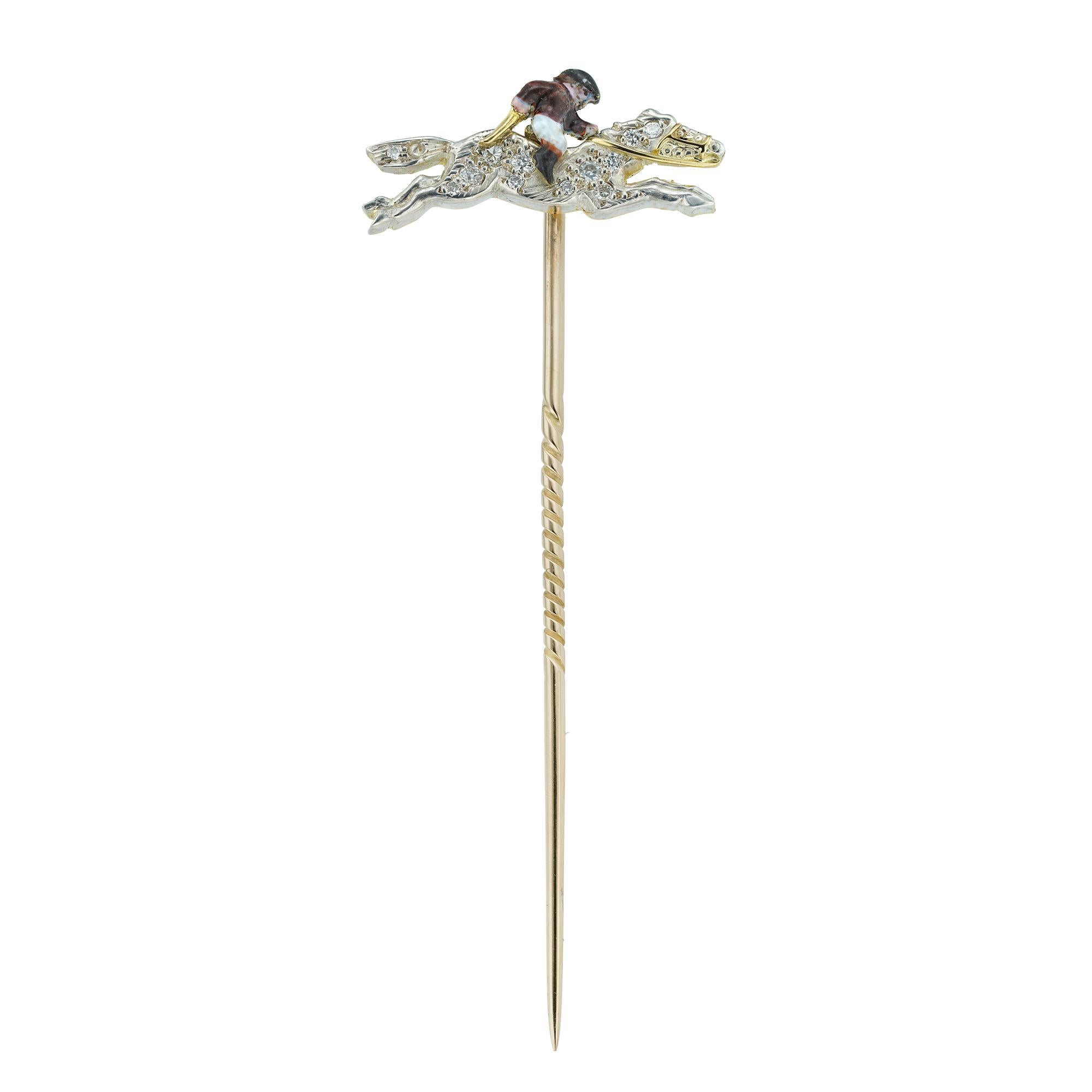 A horse and jockey tie pin, the horse jumping, set with old-cut diamonds with an enamelled jockey wearing brown and white silk racing colours, set in silver to a yellow gold back, circa 1950, the jewelled part measuring approximately 1cm long and