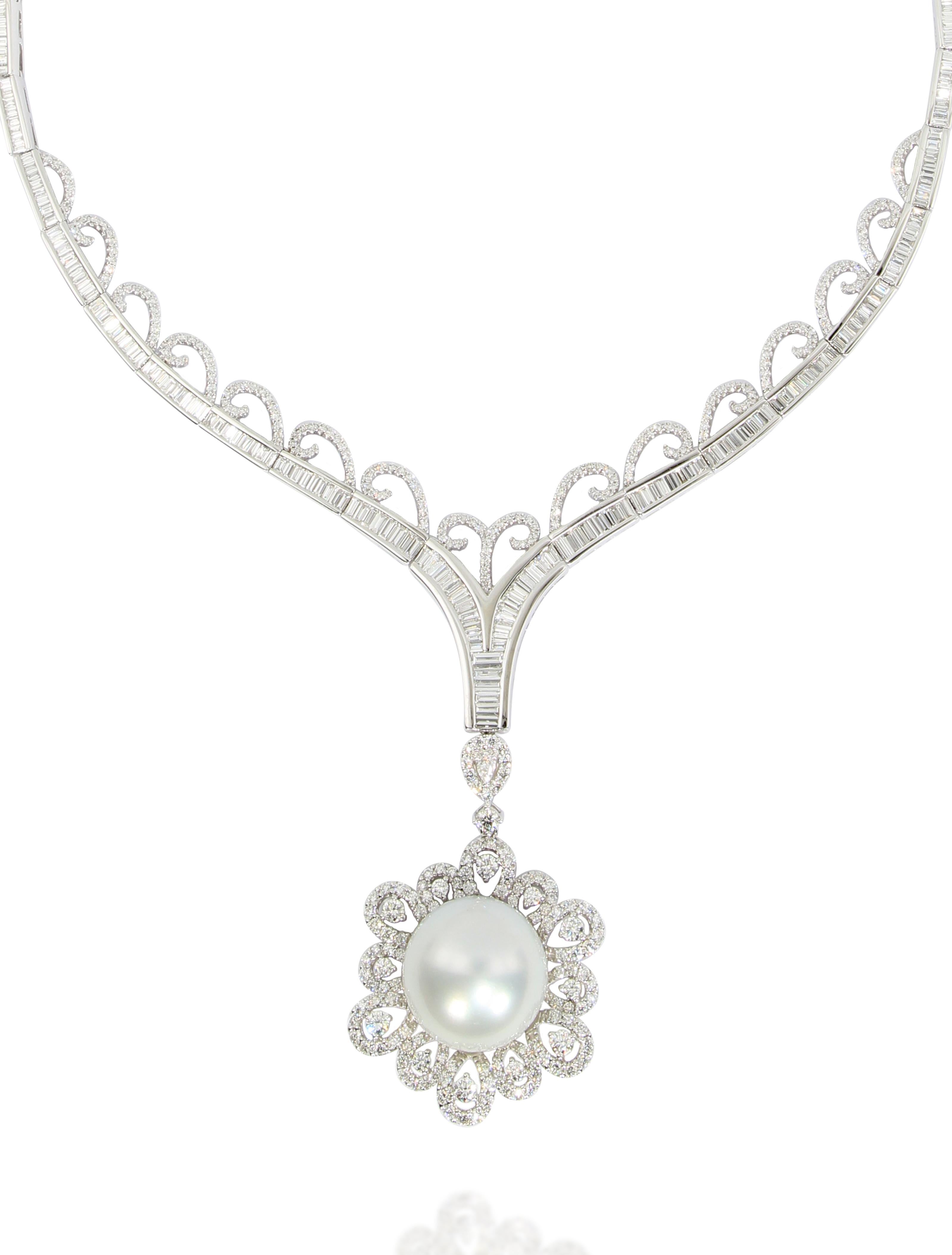 A magnificent South Sea pearl pendant set in 18 Karat white gold. This 16-16.5mm huge white south sea pearl is set in a frame composed of pear shape and round brilliant cut diamonds weighing 1.98 carats in total.  It comes with an elegent necklace