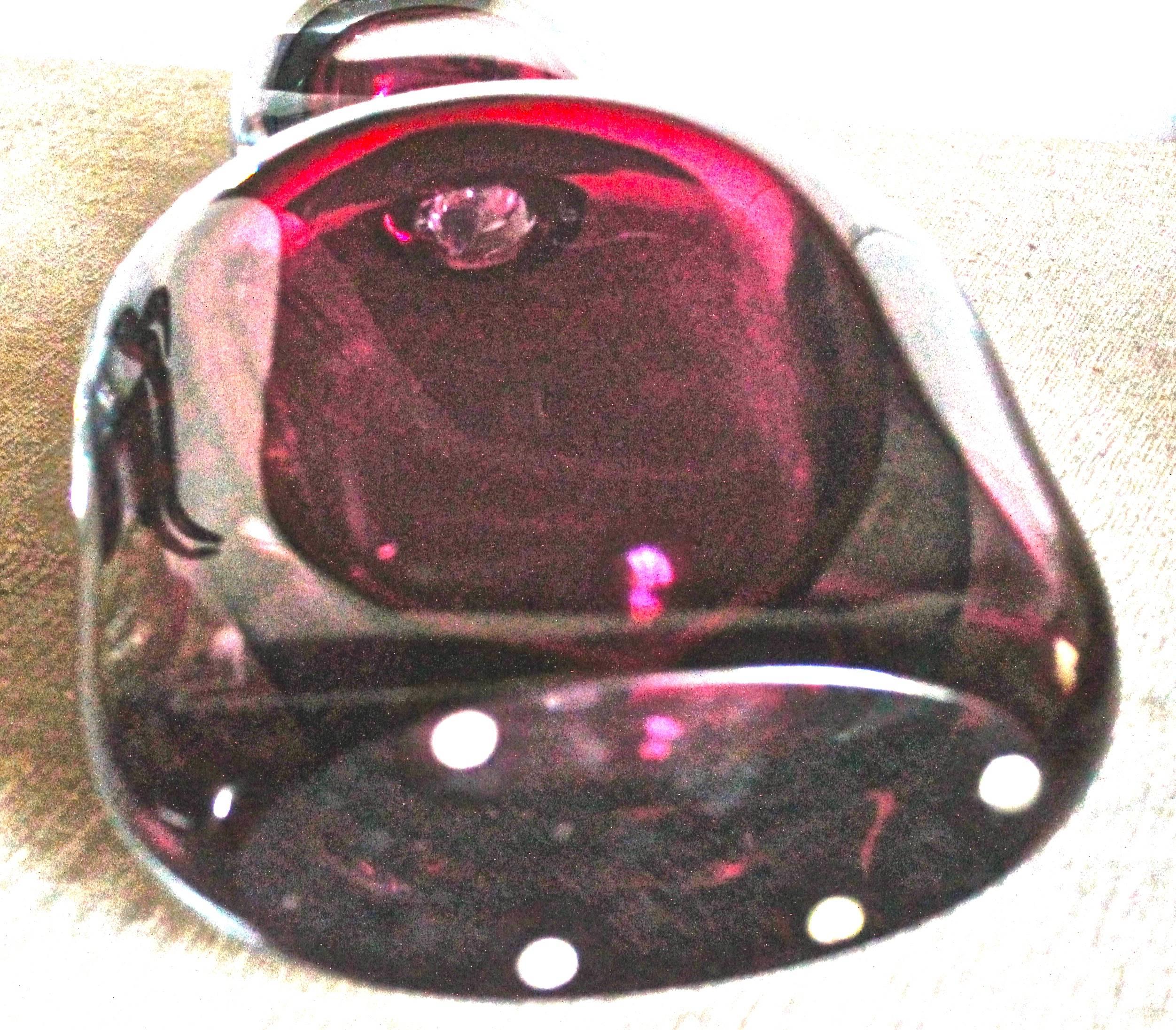 Three layers of 'Sommerso' Vetri- a layer of burgundy red within a layer of smokey grey within a layer of clear glass. Constructed of two pieces- a bottle and a stopper, the stopper is attached/glued to the bottle and does not come off. 1960s