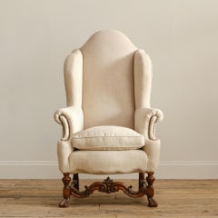 A huge 19th century William & Mary style wingback armchair