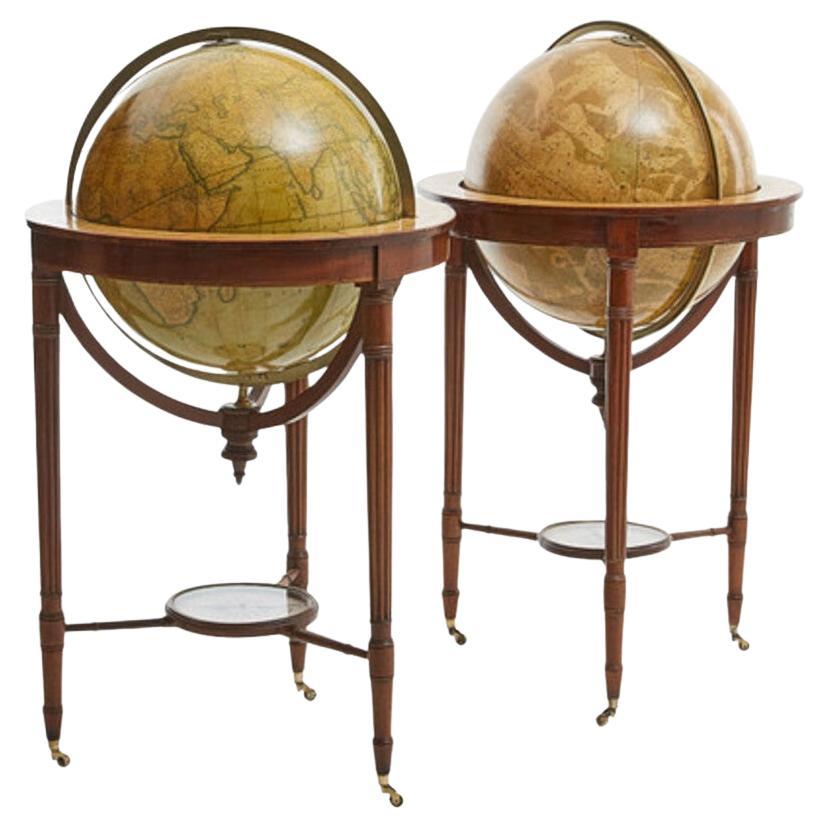 G.F. Cruchley (UK, 1796-1880)
London ca 1850

A magnificent pair of terrestrial and celestial globes. Equatorial table engraved with the signs of the zodiac and resting on 3 mahogany molded feet held by a compass at the spacer. With graduated brass