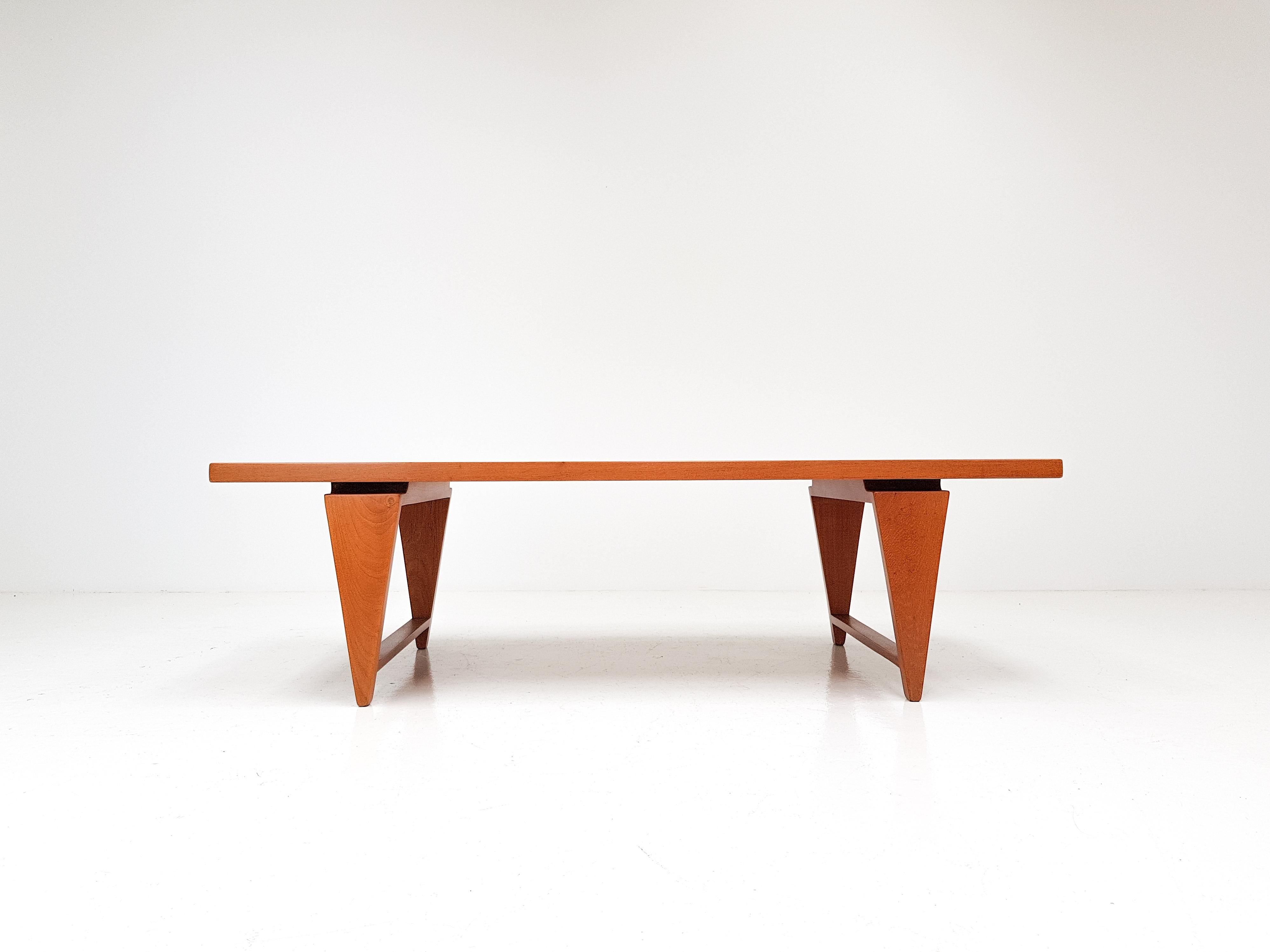 A solid teak coffee table by Illum Wikkelsø, with signature pyramidal tapered legs which feature in many of his designs and a floating top.

This is a heavy piece with offers a very high-quality feel and impactful presence, the leg shape offers a