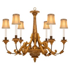 A Italian 18th century Baroque st. Giltwood, Iron, and Mecca chandelier