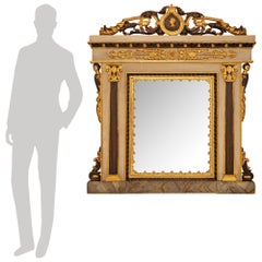 A Italian 18th century Neo-Classical st. patinated and Giltwood mirror