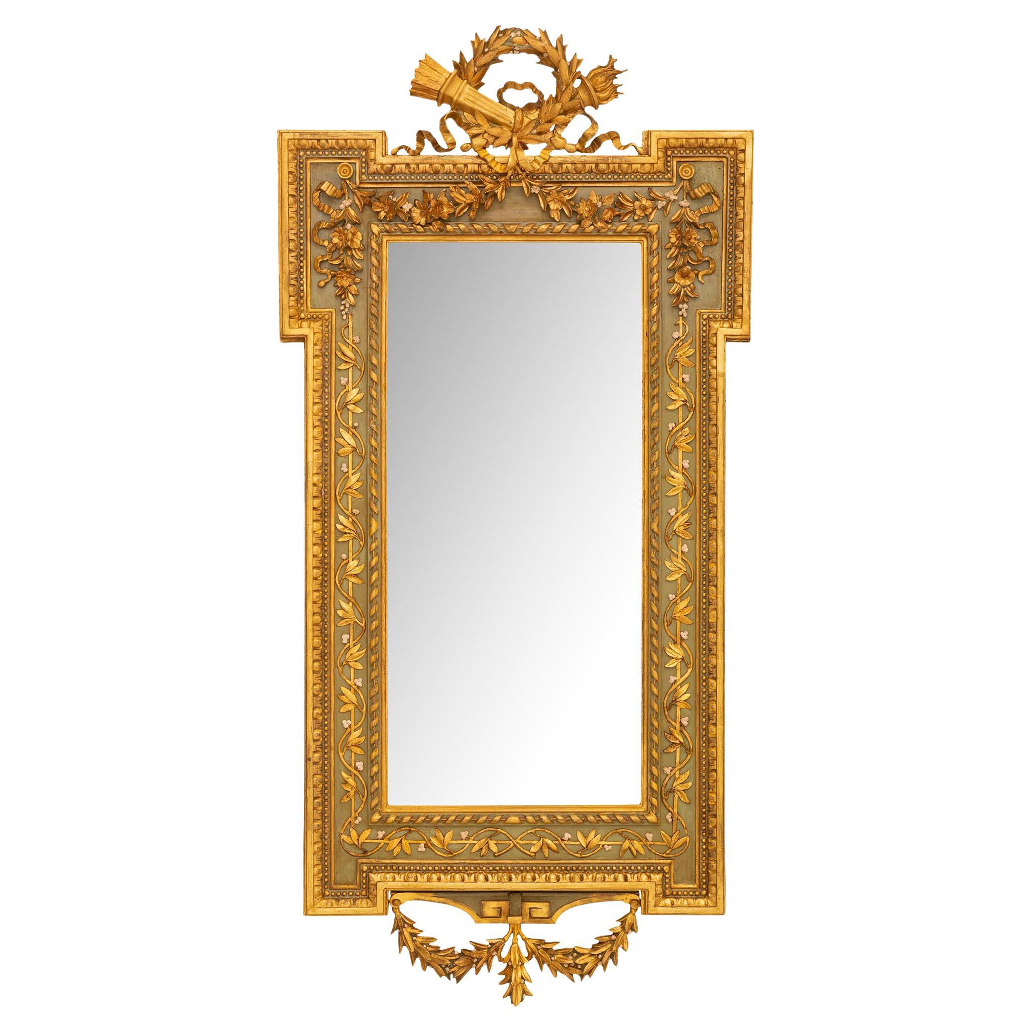 A Italian 19th century Louis XVI st. patinated and Giltwood mirror