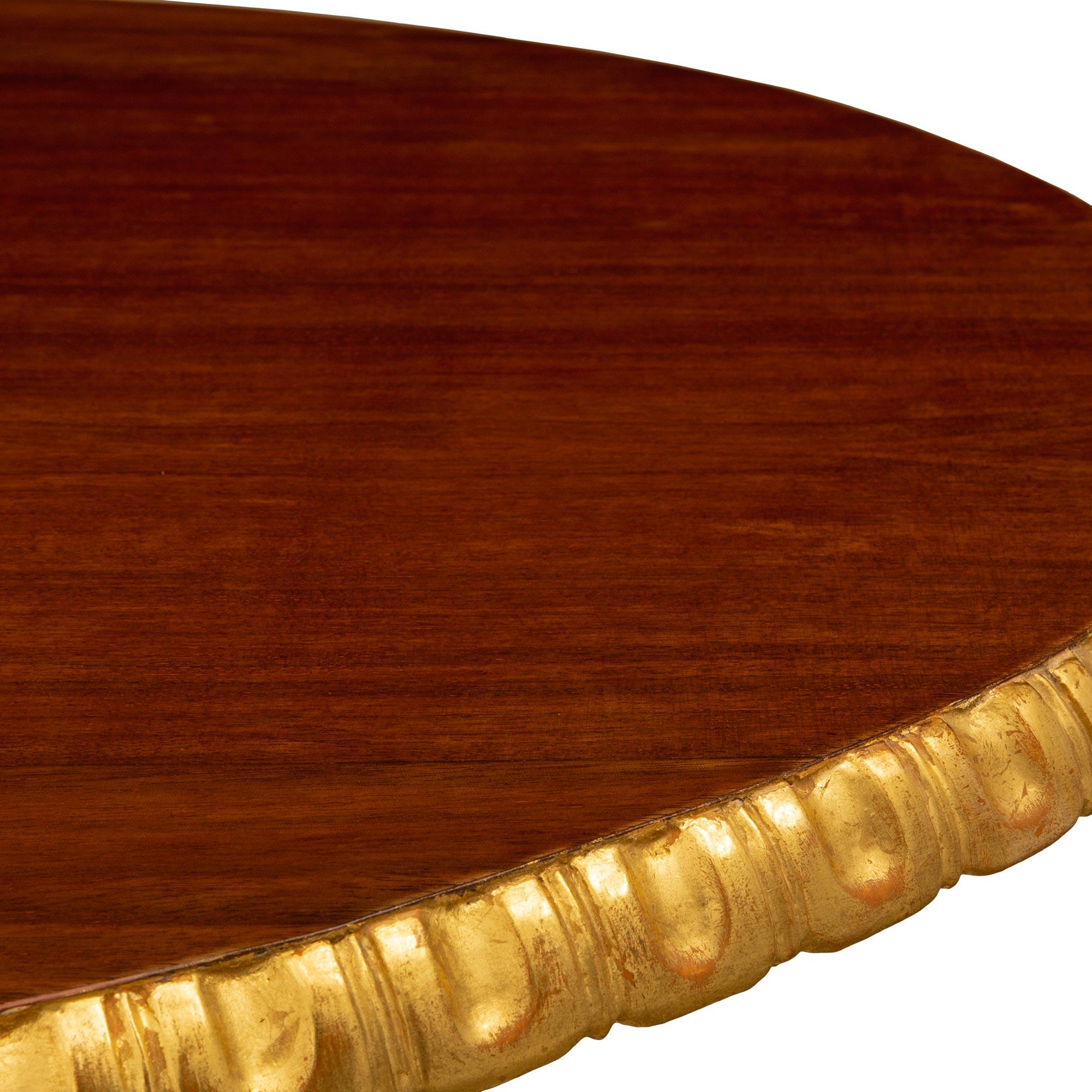 A Italian late 18th century Baroque st. Giltwood and Walnut side table For Sale 1