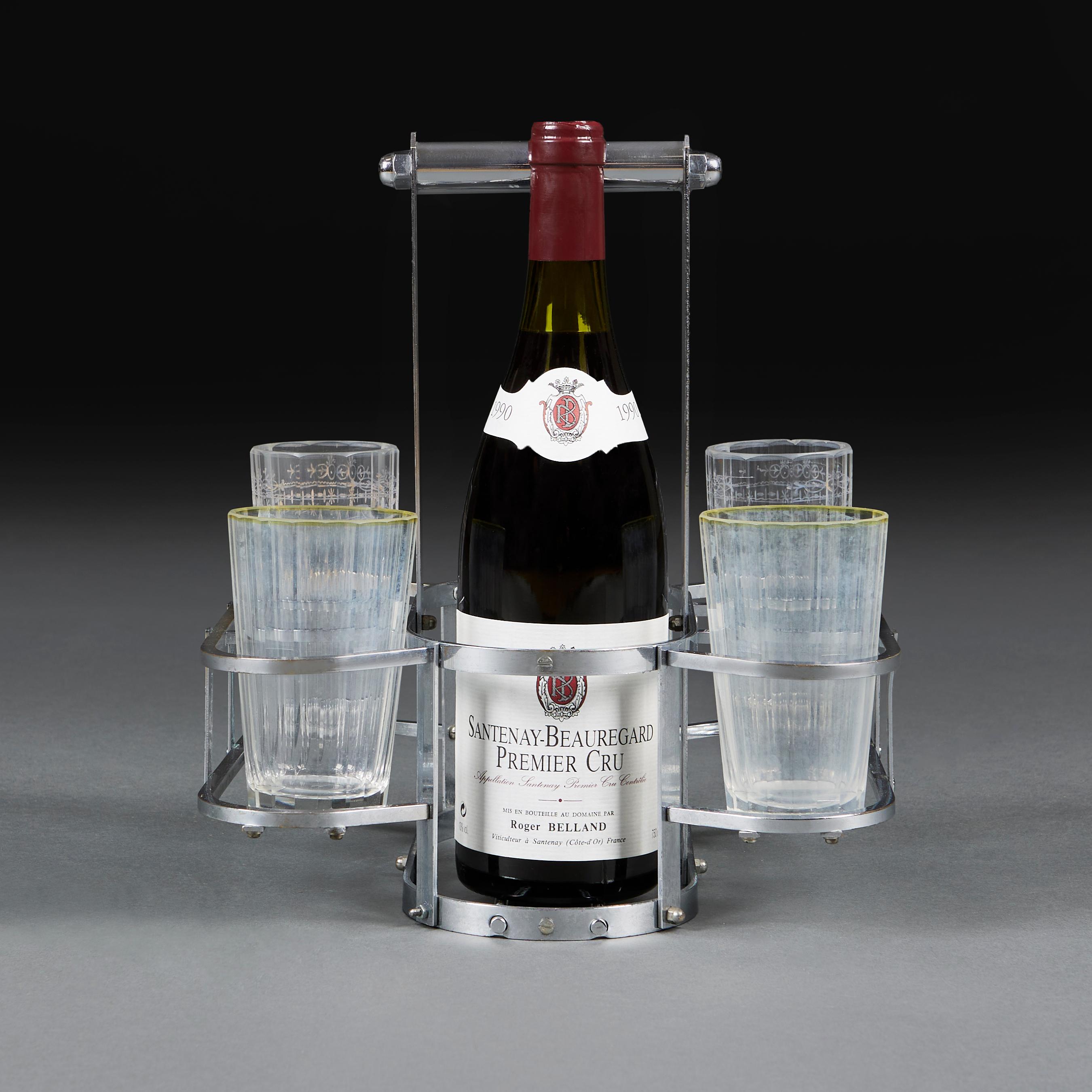 A mid-century, silver-plated wine bottle carrier by Jacques Adnet with supports for two bottles and six glasses.