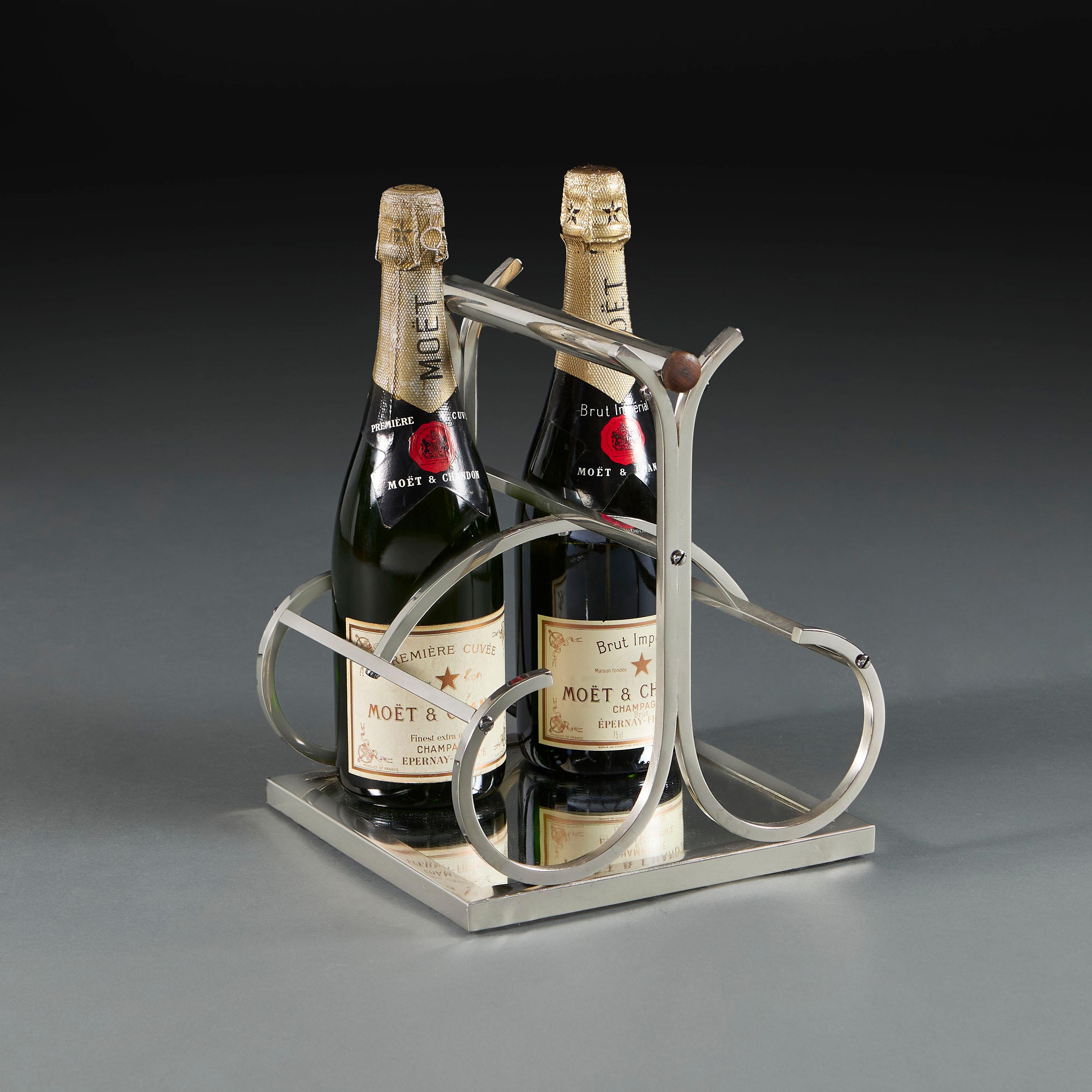 France, circa 1940

A wine bottle carrier by Jacques Adnet of sculptural form with curved polished steel arms and frame and the base inset with patinated glass, to hold four wine bottles.

Height 30.00cm

Width 23.00cm

Depth 23.00cm