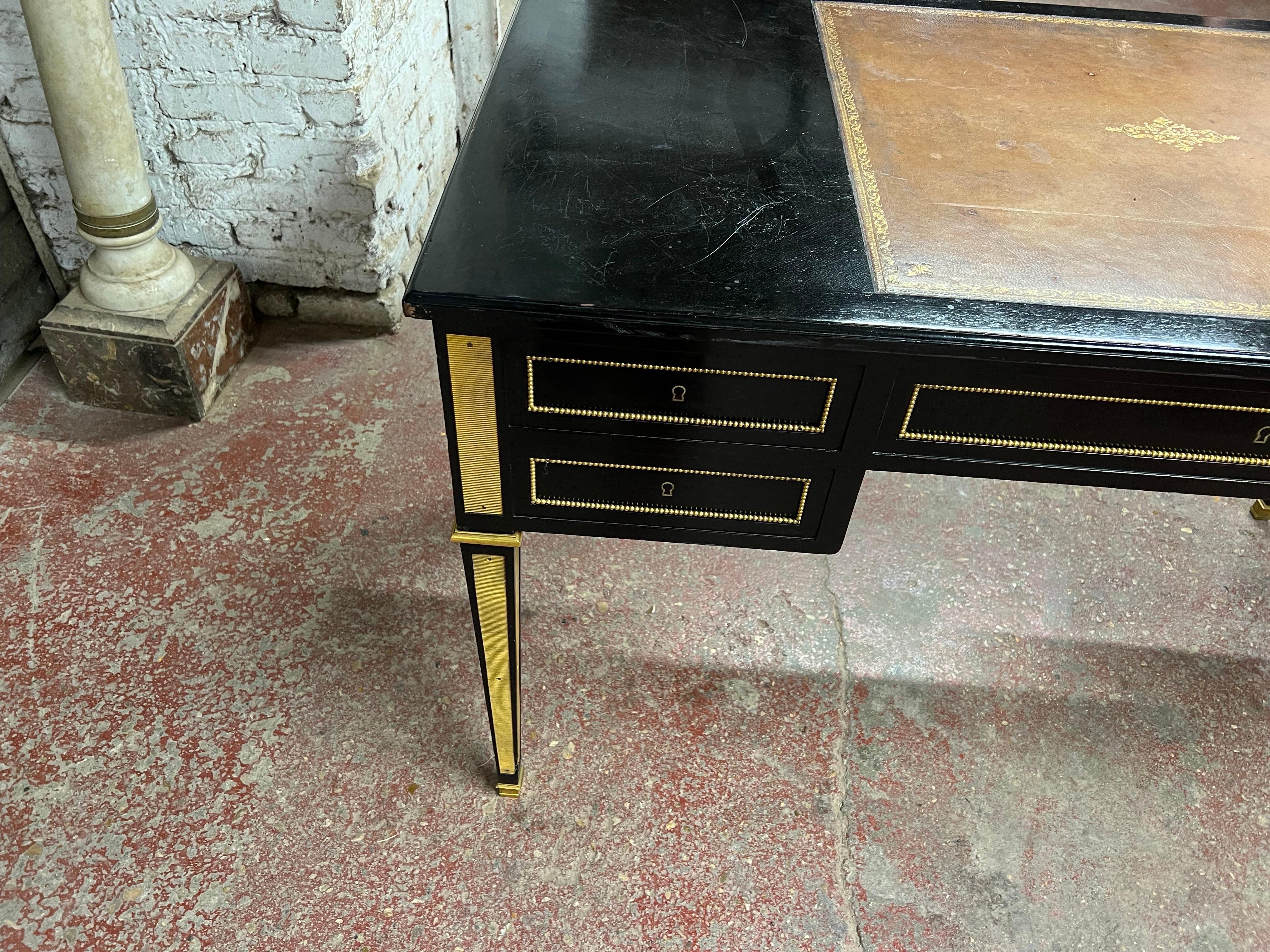 A neo classic black lacquer double face , can float in oak circa 1950